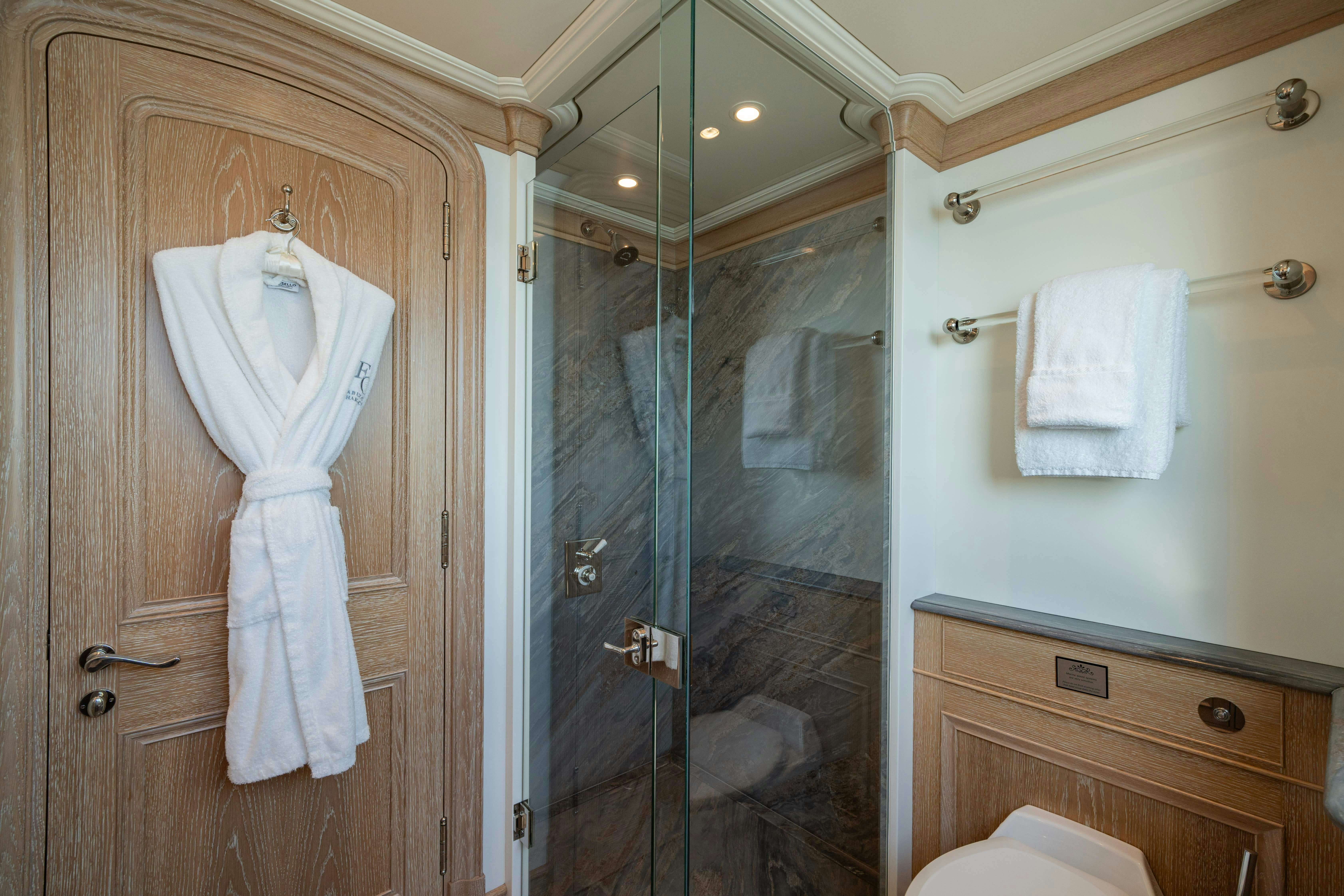 a bathroom with a glass shower aboard FABULOUS CHARACTER Yacht for Charter