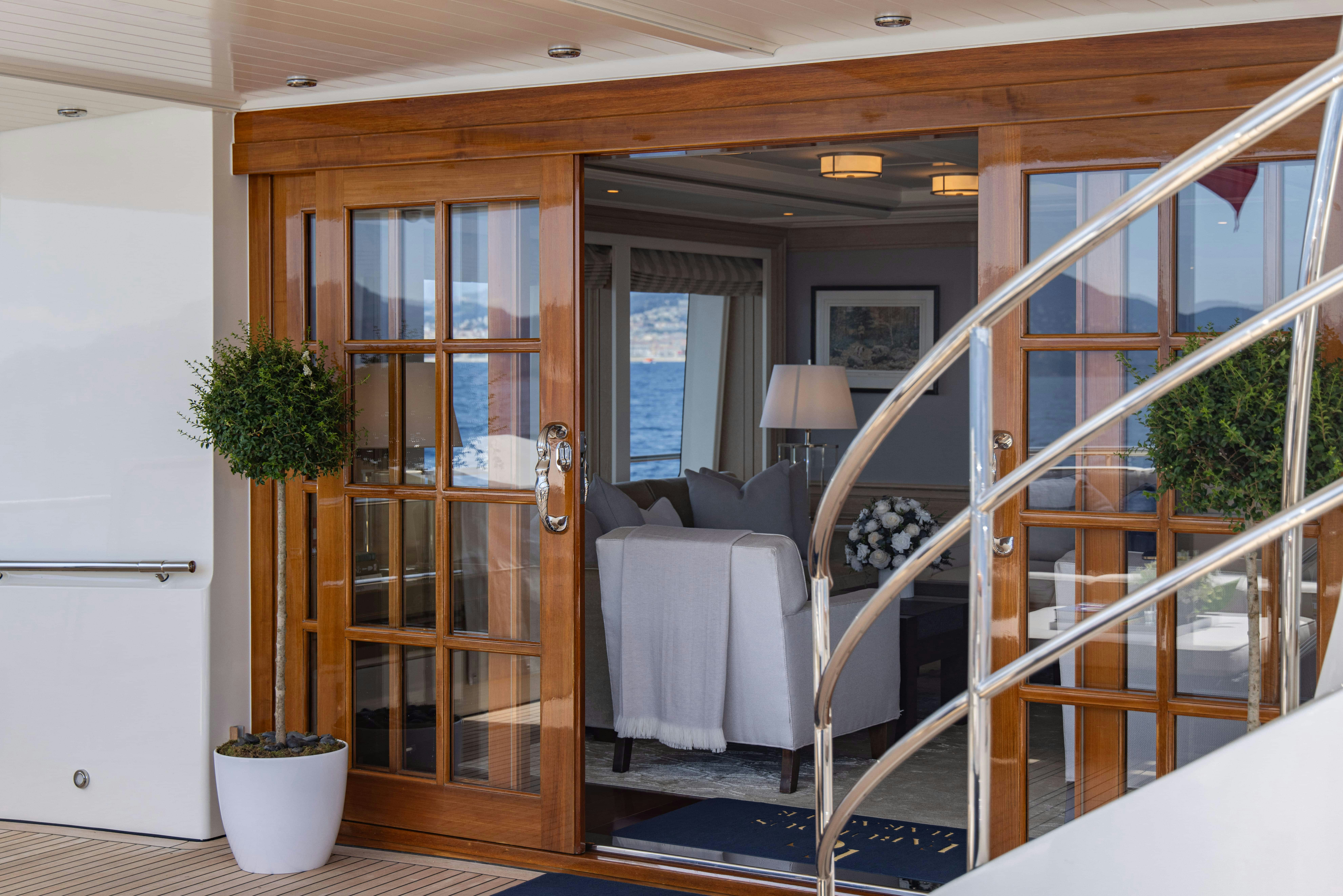 a room with a bed and a chair aboard FABULOUS CHARACTER Yacht for Charter