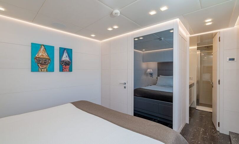 a room with a couch and a table aboard SANDS Yacht for Charter