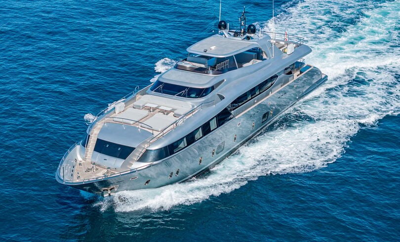 a white yacht on the water aboard SANDS Yacht for Charter