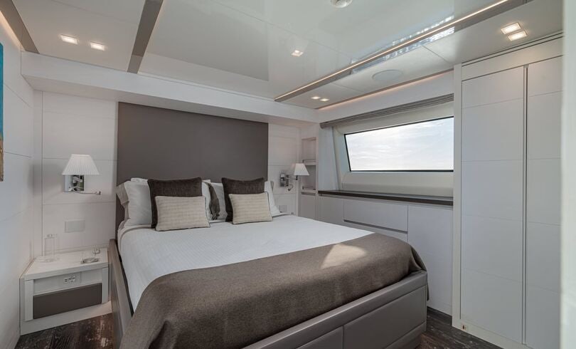 a bed in a room aboard SANDS Yacht for Charter
