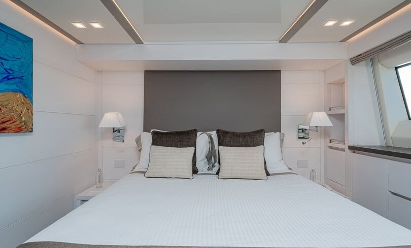 a large bed in a room aboard SANDS Yacht for Charter