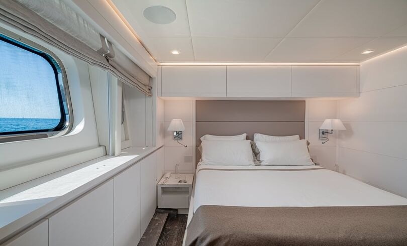 a room with two beds aboard SANDS Yacht for Charter