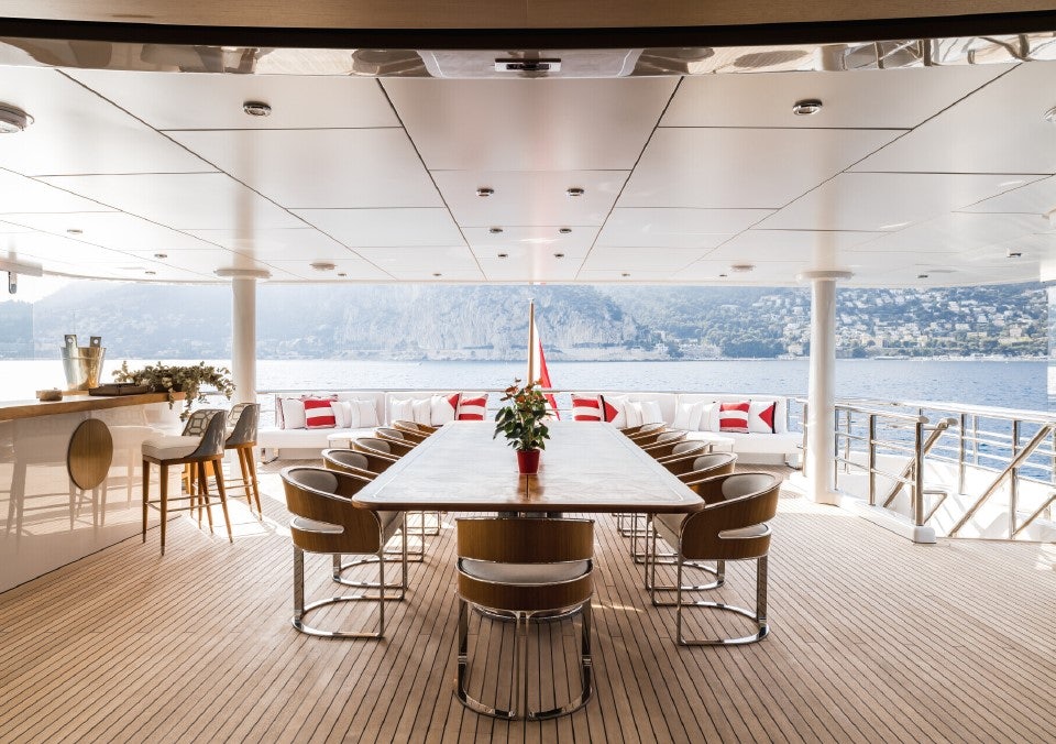 a table and chairs on a deck aboard VENTUM MARIS Yacht for Sale