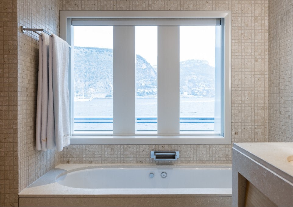 a bathroom with a large window aboard VENTUM MARIS Yacht for Sale