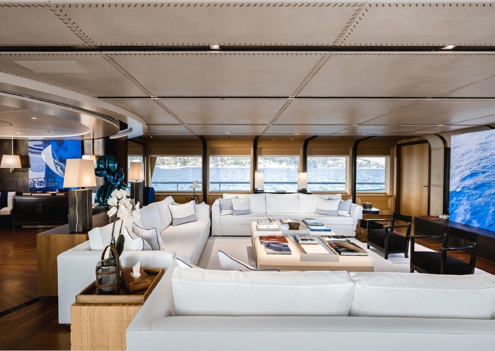 a large room with a couch and a tv aboard VENTUM MARIS Yacht for Sale