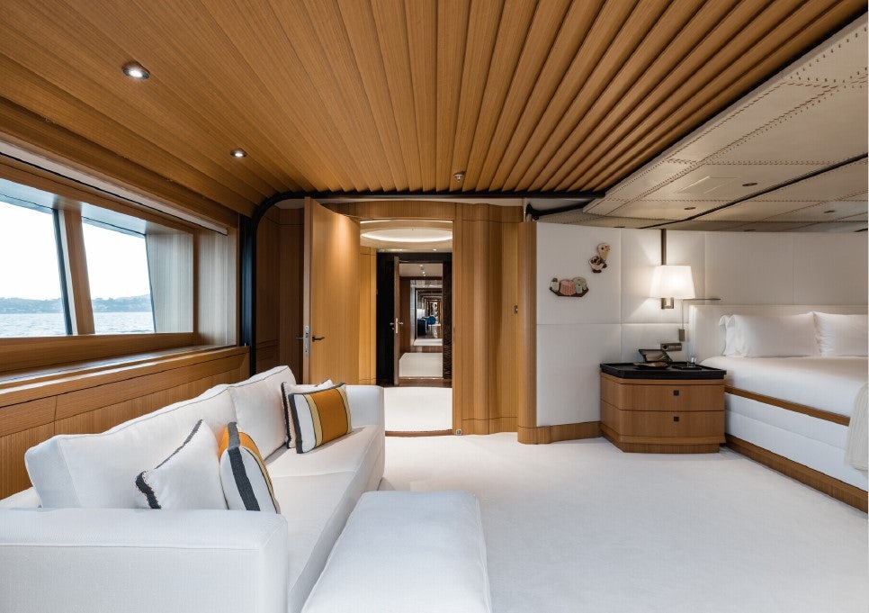 a bedroom with a bed and a desk aboard VENTUM MARIS Yacht for Sale
