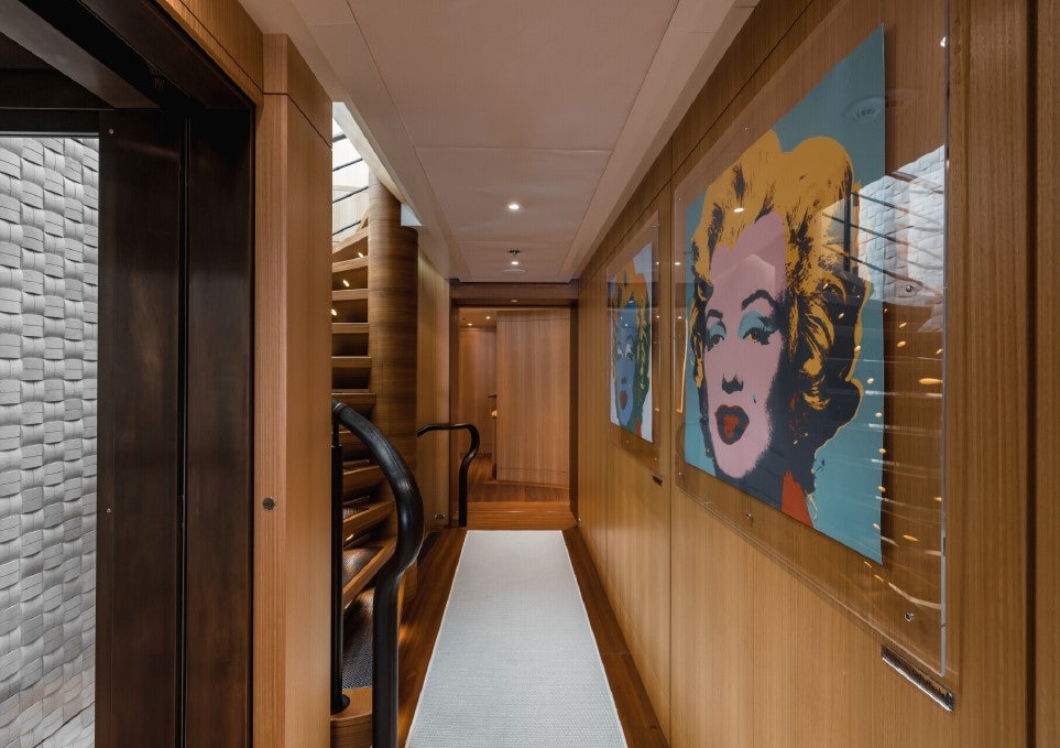 a hallway with a painting on the wall aboard VENTUM MARIS Yacht for Sale