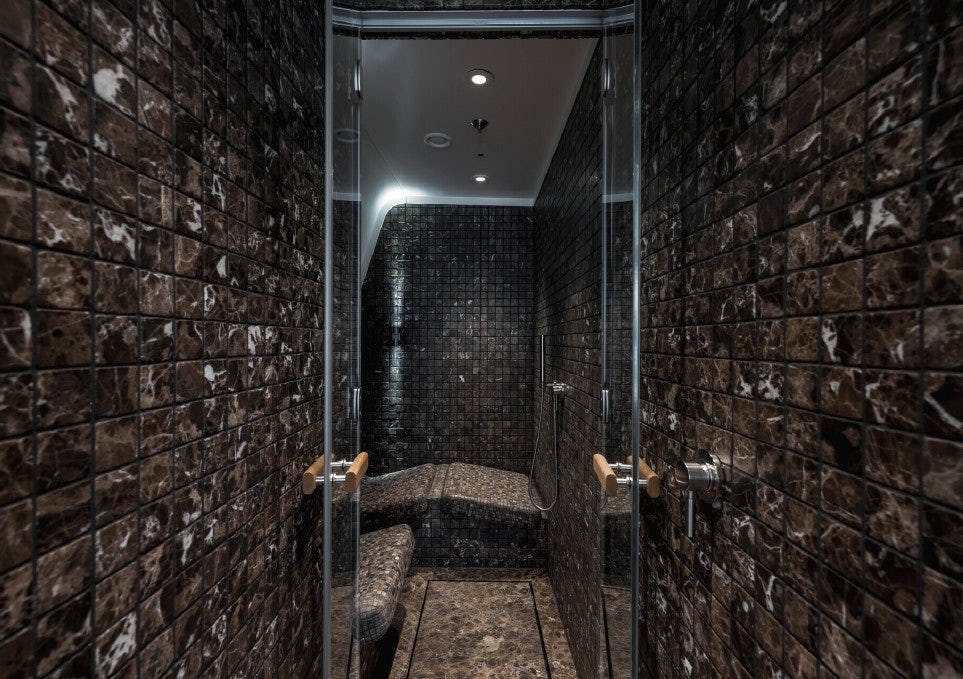 a room with a chair and a bed aboard VENTUM MARIS Yacht for Sale