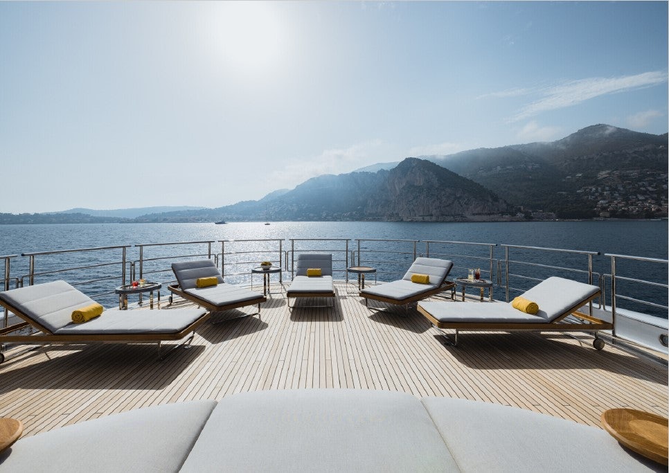 a deck with chairs on it by the water aboard VENTUM MARIS Yacht for Sale