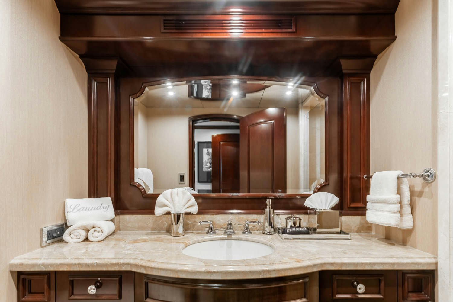 a bathroom with a large mirror aboard NICOLE EVELYN Yacht for Charter