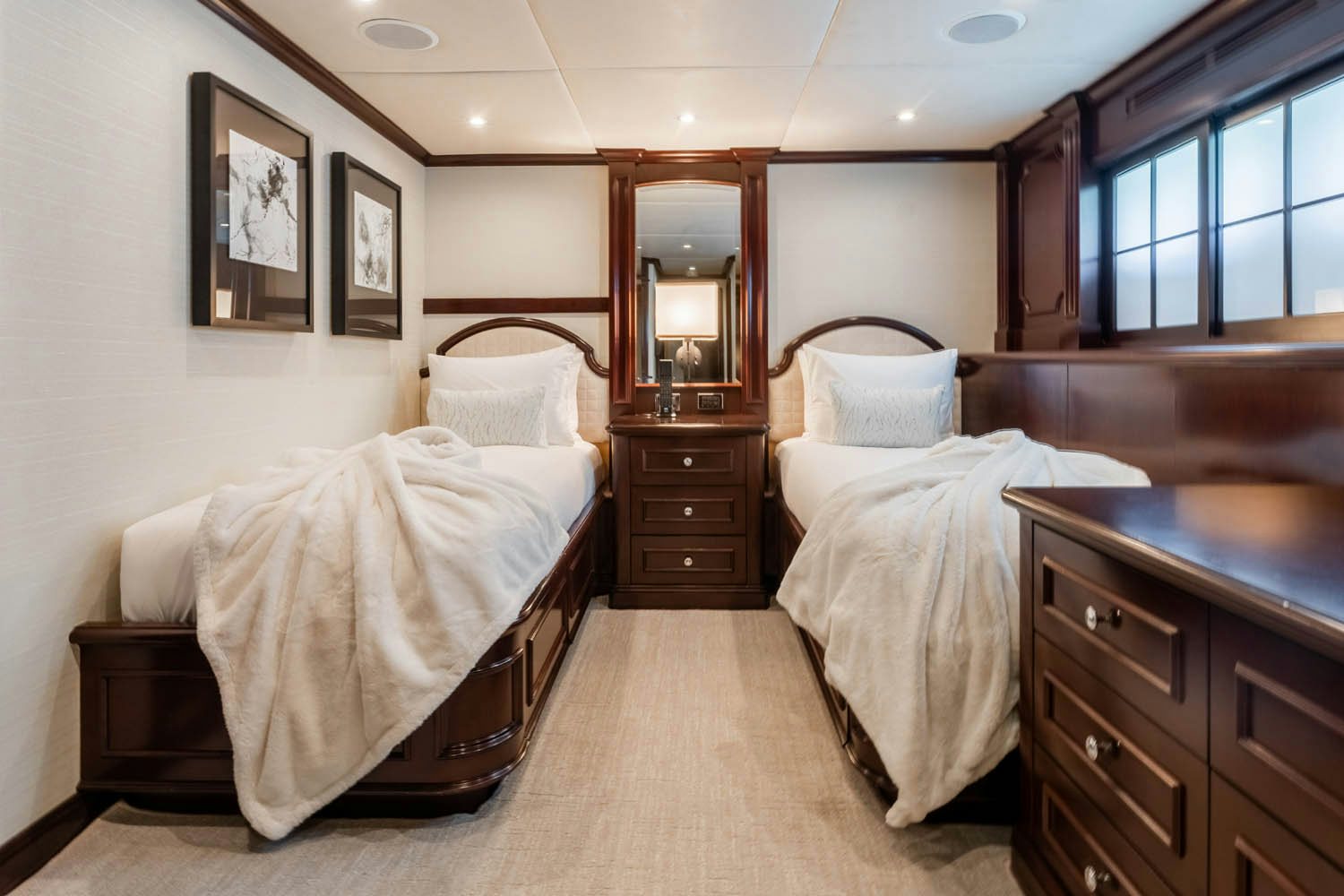 a bedroom with two beds aboard NICOLE EVELYN Yacht for Charter