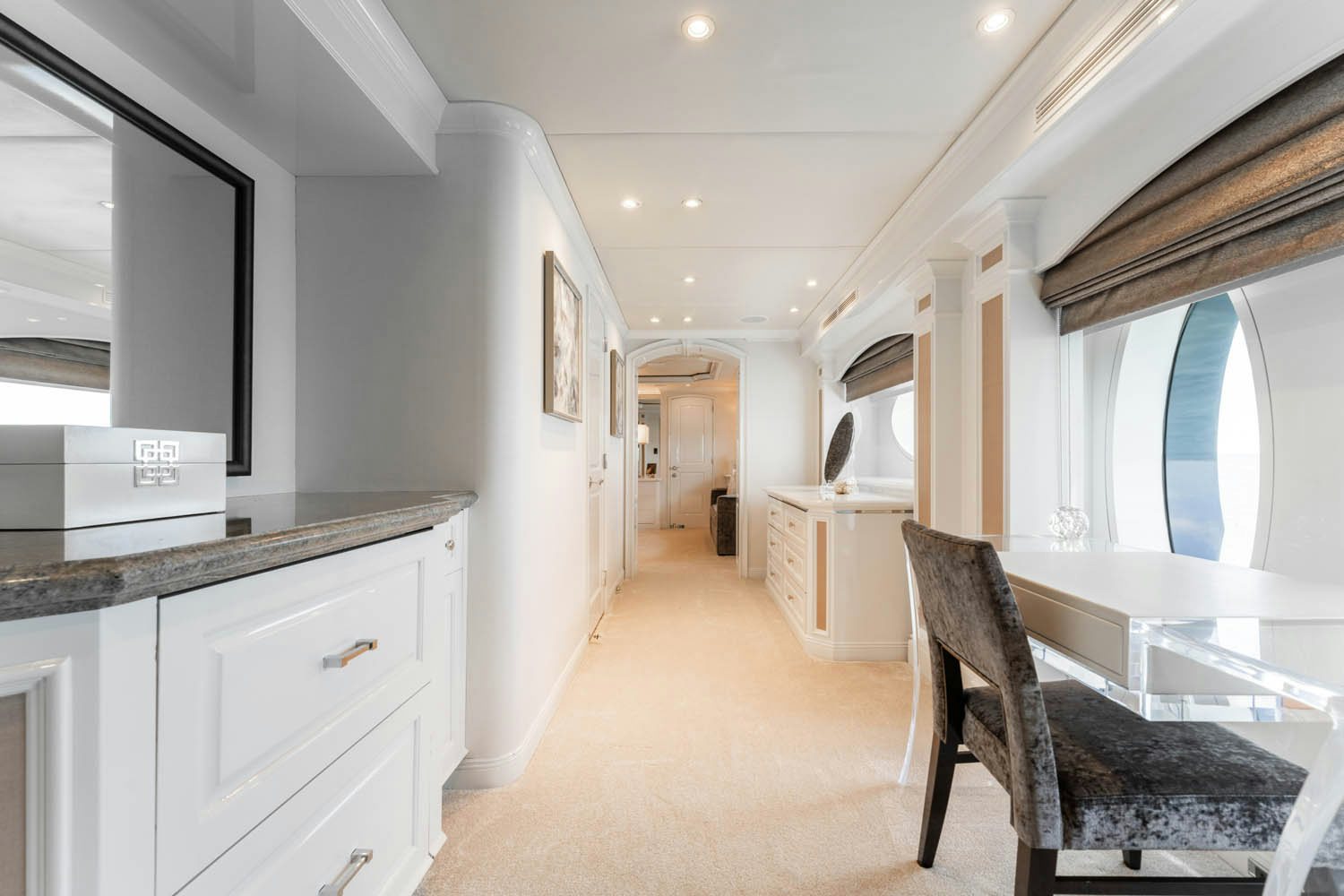 a room with a desk and chairs aboard NICOLE EVELYN Yacht for Charter