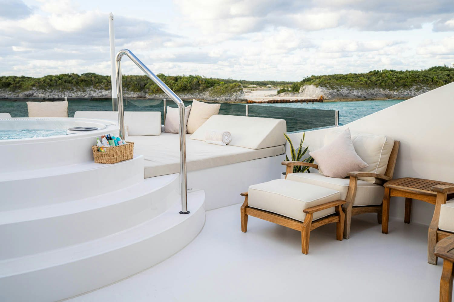 a room with a pool and chairs aboard NICOLE EVELYN Yacht for Charter