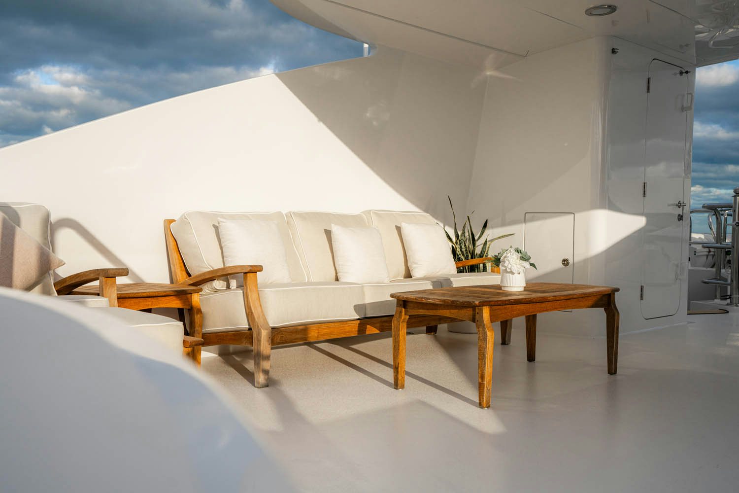 a room with a couch and a table aboard NICOLE EVELYN Yacht for Charter