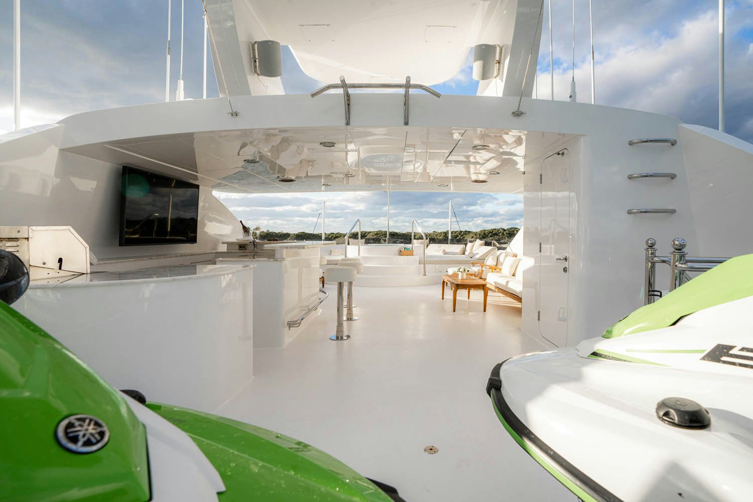inside of a room with a large screen and a table aboard NICOLE EVELYN Yacht for Charter