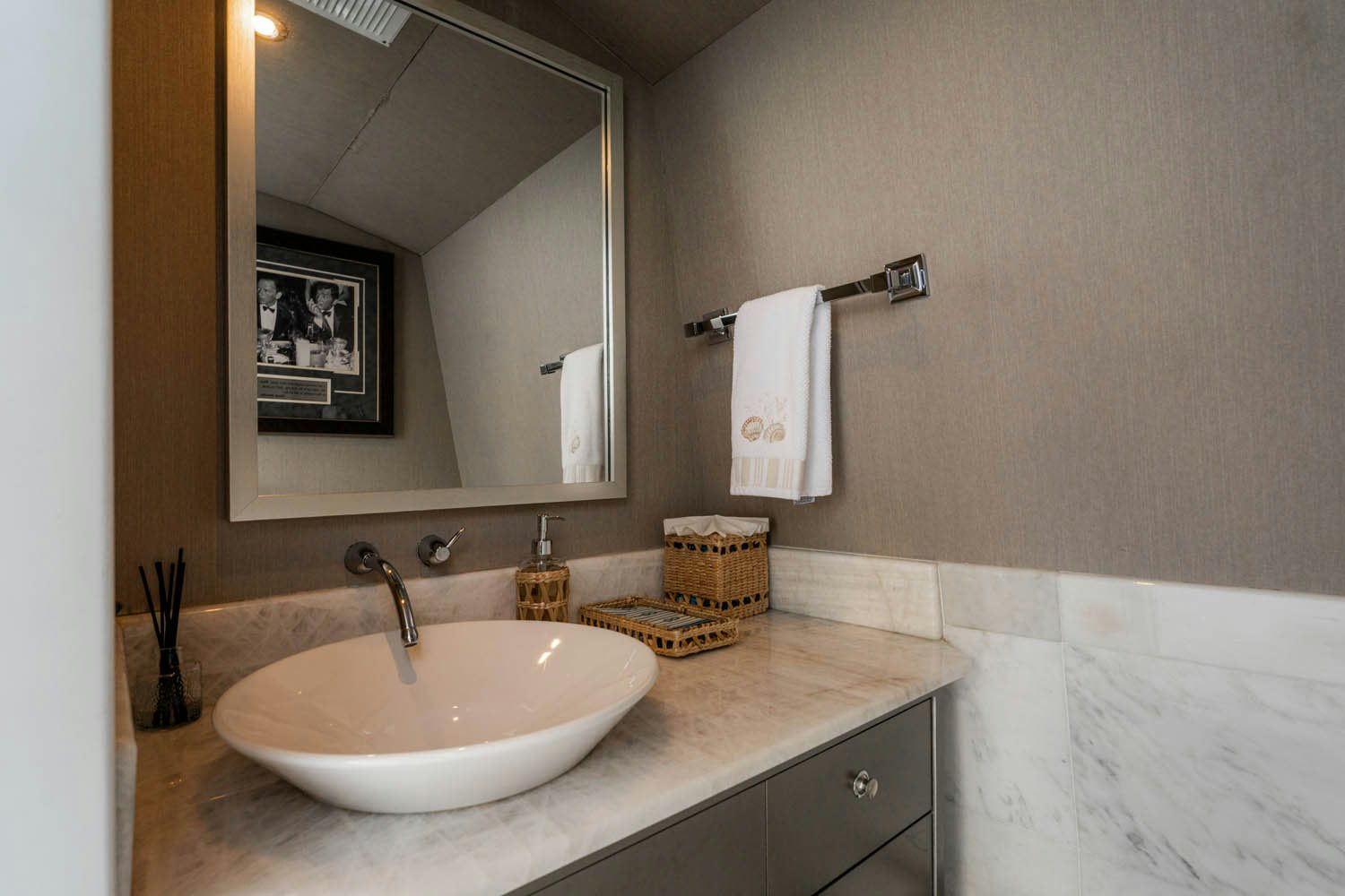 a bathroom with a large mirror aboard NICOLE EVELYN Yacht for Charter