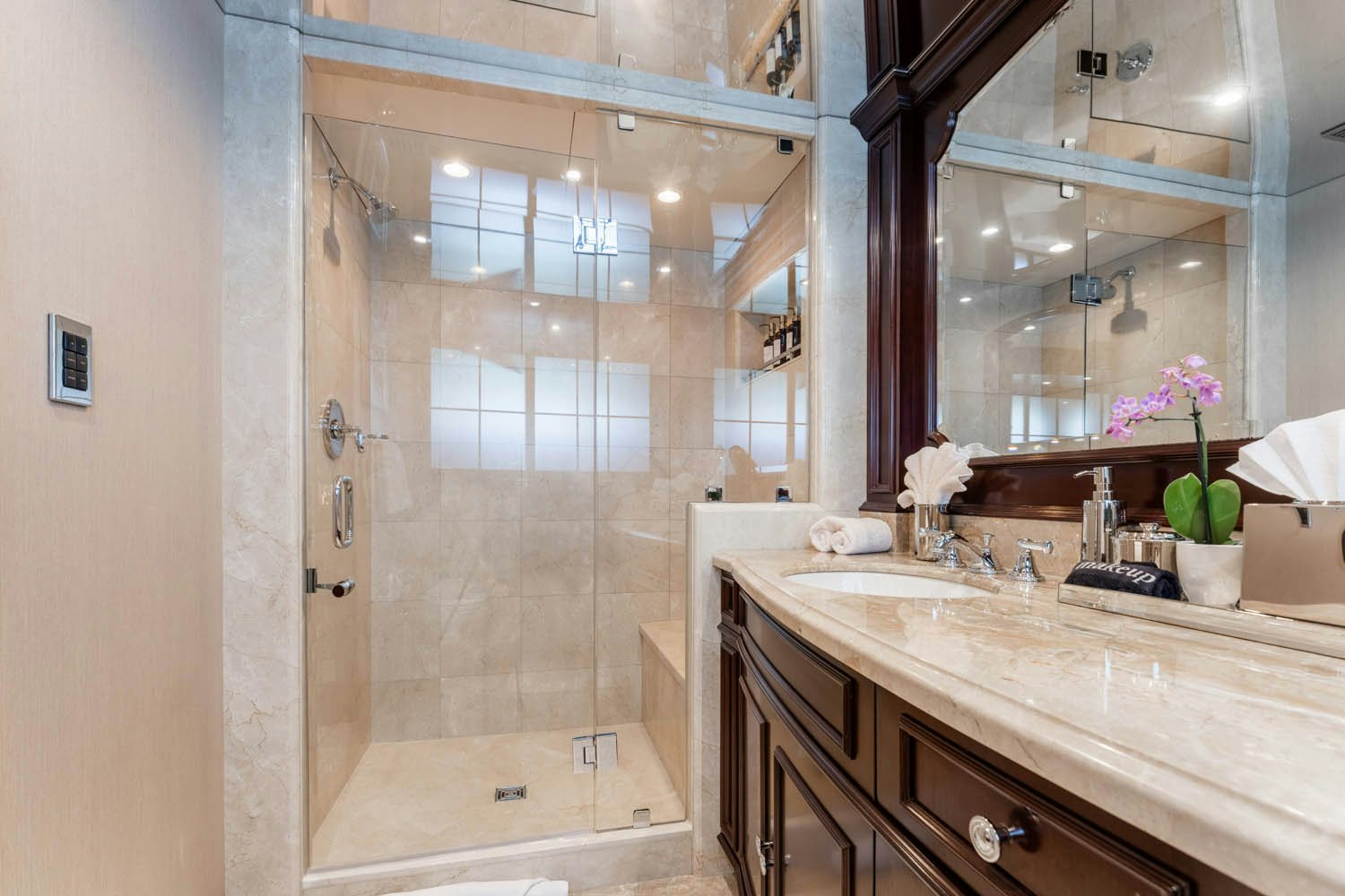 a bathroom with a glass shower aboard NICOLE EVELYN Yacht for Charter
