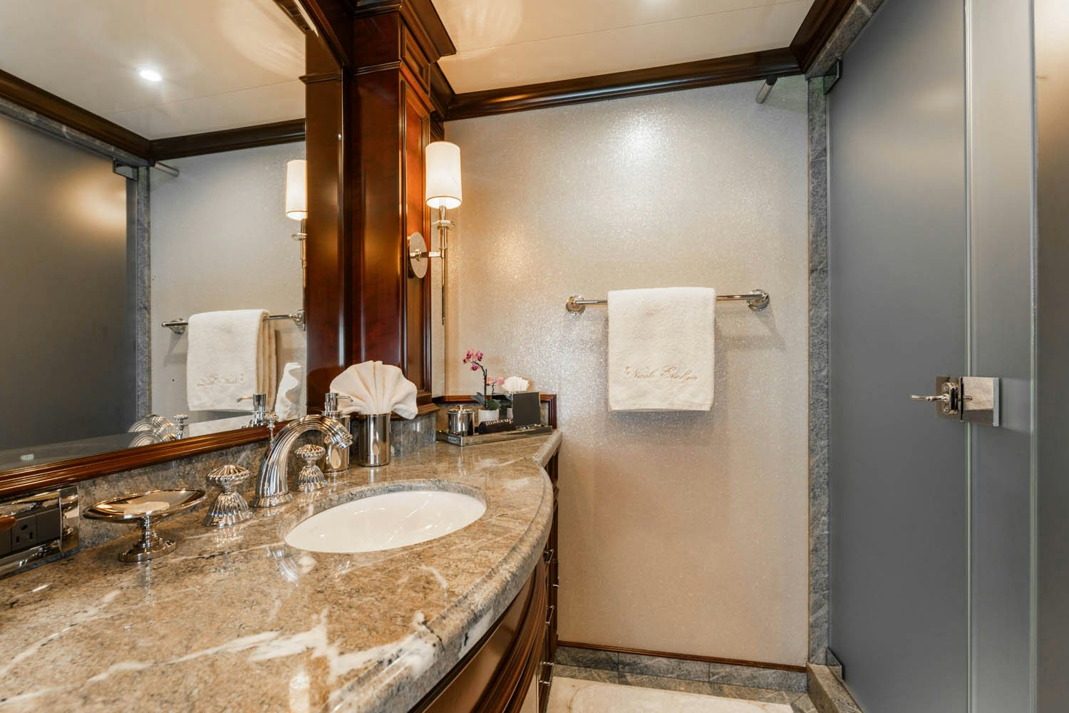 a bathroom with a countertop sink and a mirror aboard NICOLE EVELYN Yacht for Charter