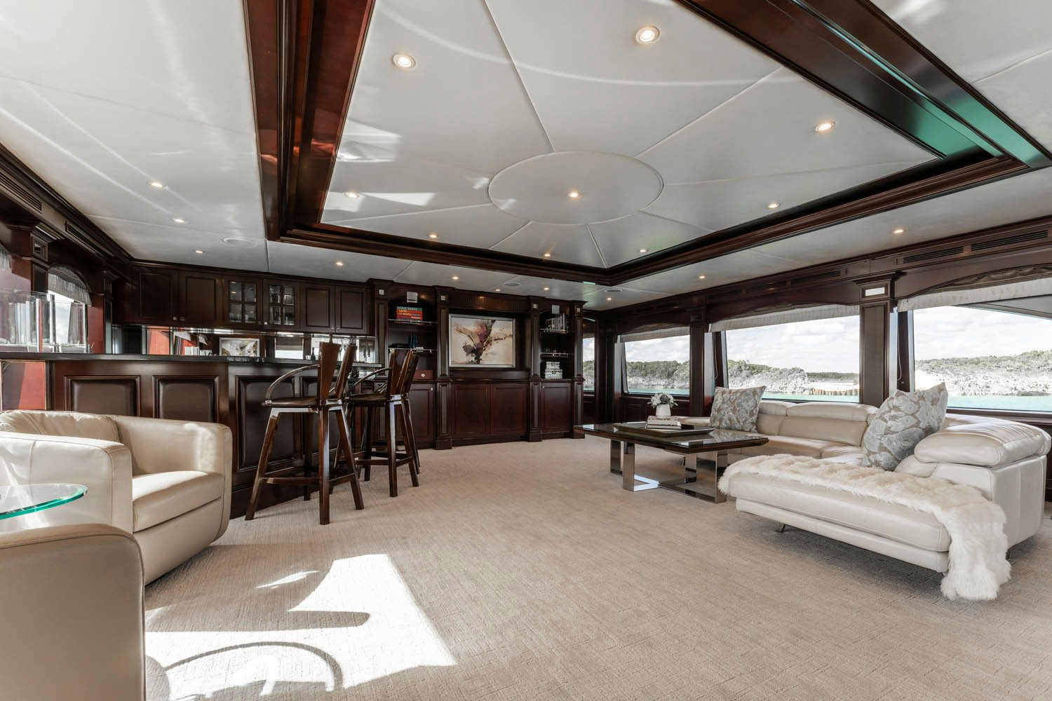a living room with a large open window aboard NICOLE EVELYN Yacht for Charter