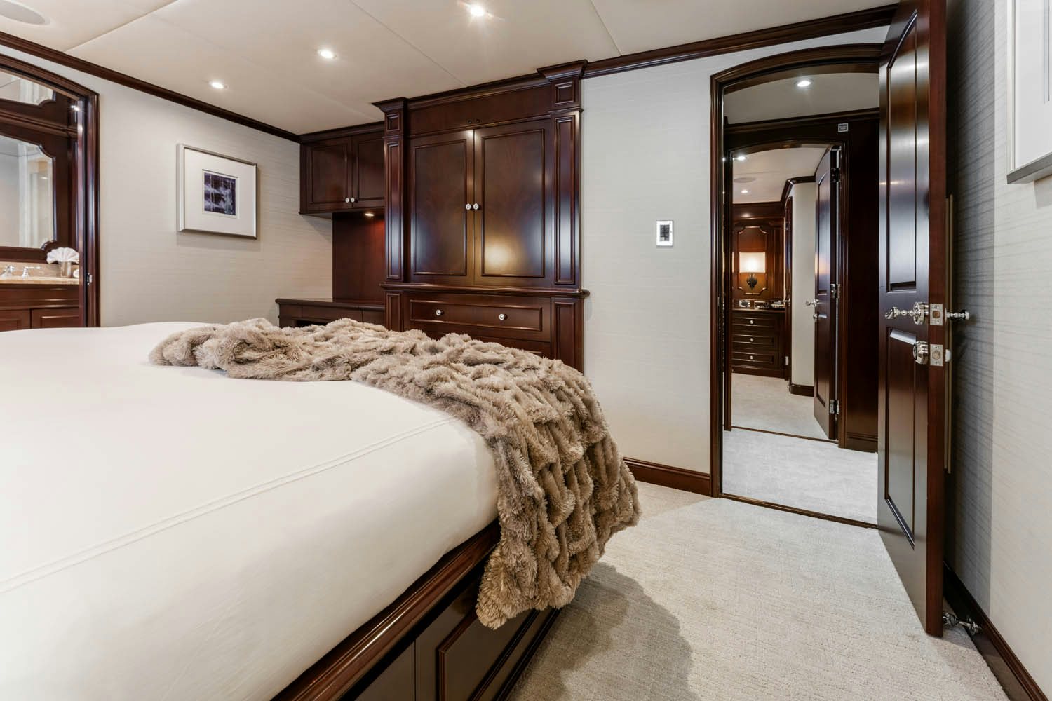 a bedroom with a bed and a closet aboard NICOLE EVELYN Yacht for Charter