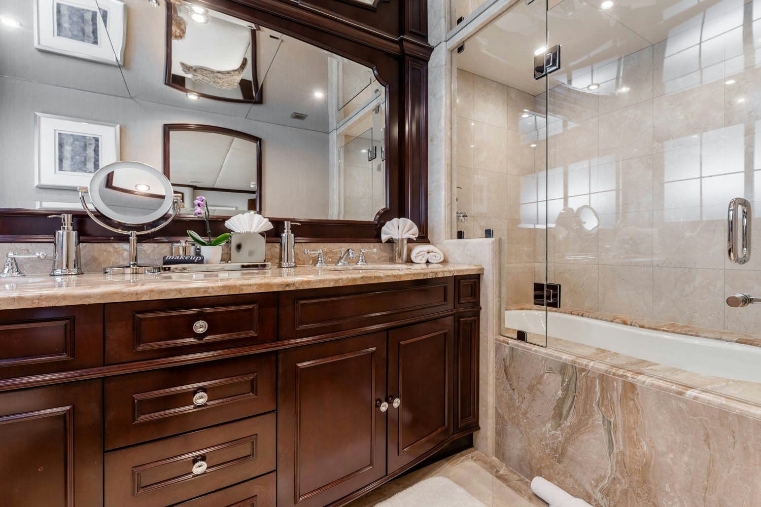 a bathroom with a glass shower aboard NICOLE EVELYN Yacht for Charter