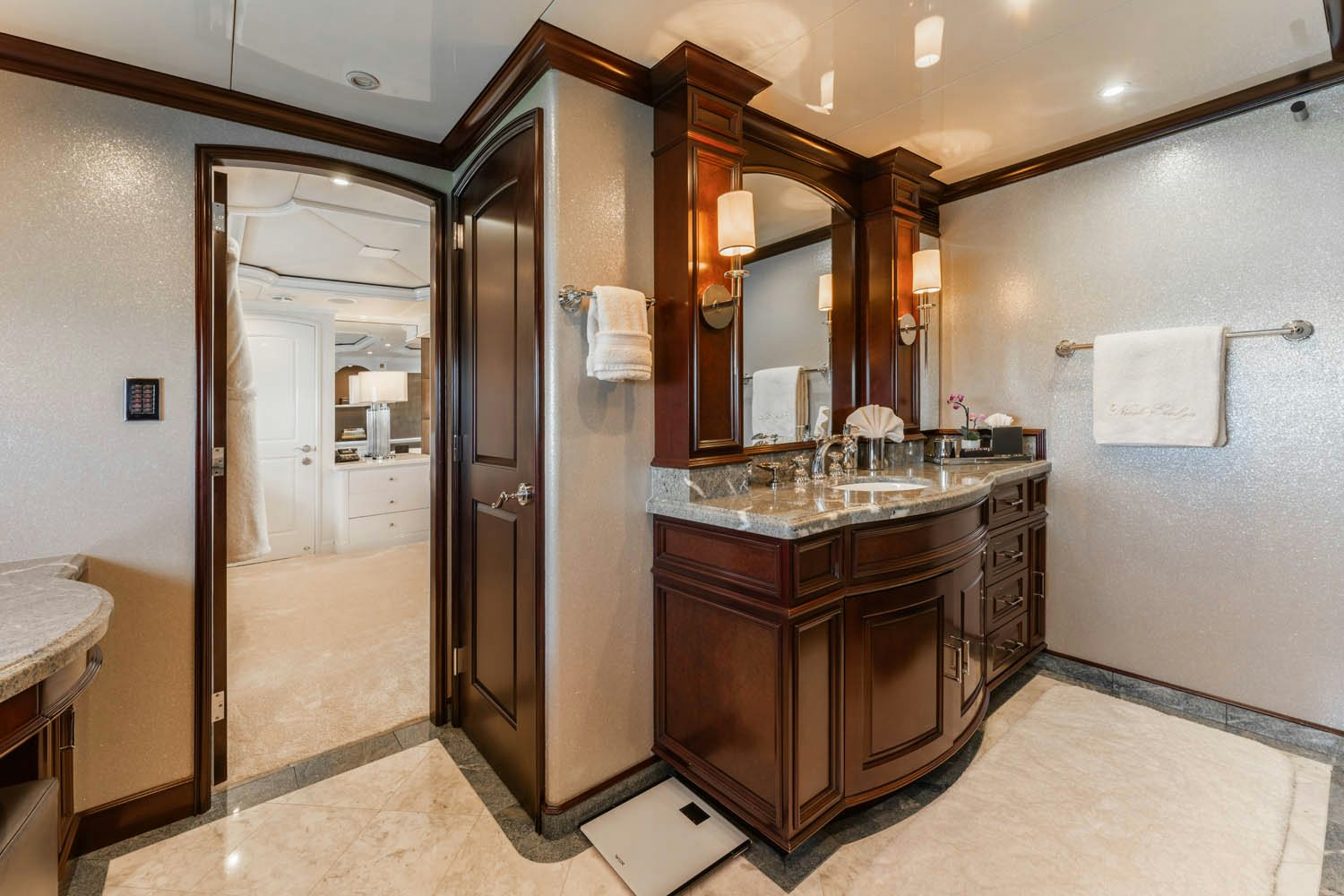 a bathroom with a sink and a mirror aboard NICOLE EVELYN Yacht for Charter