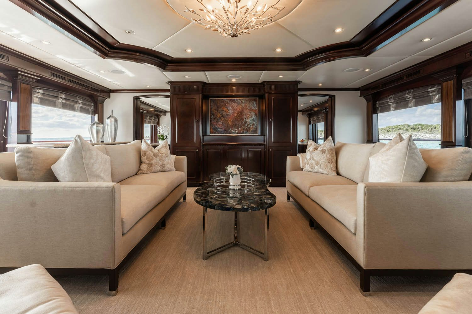 a living room with a large window aboard NICOLE EVELYN Yacht for Charter