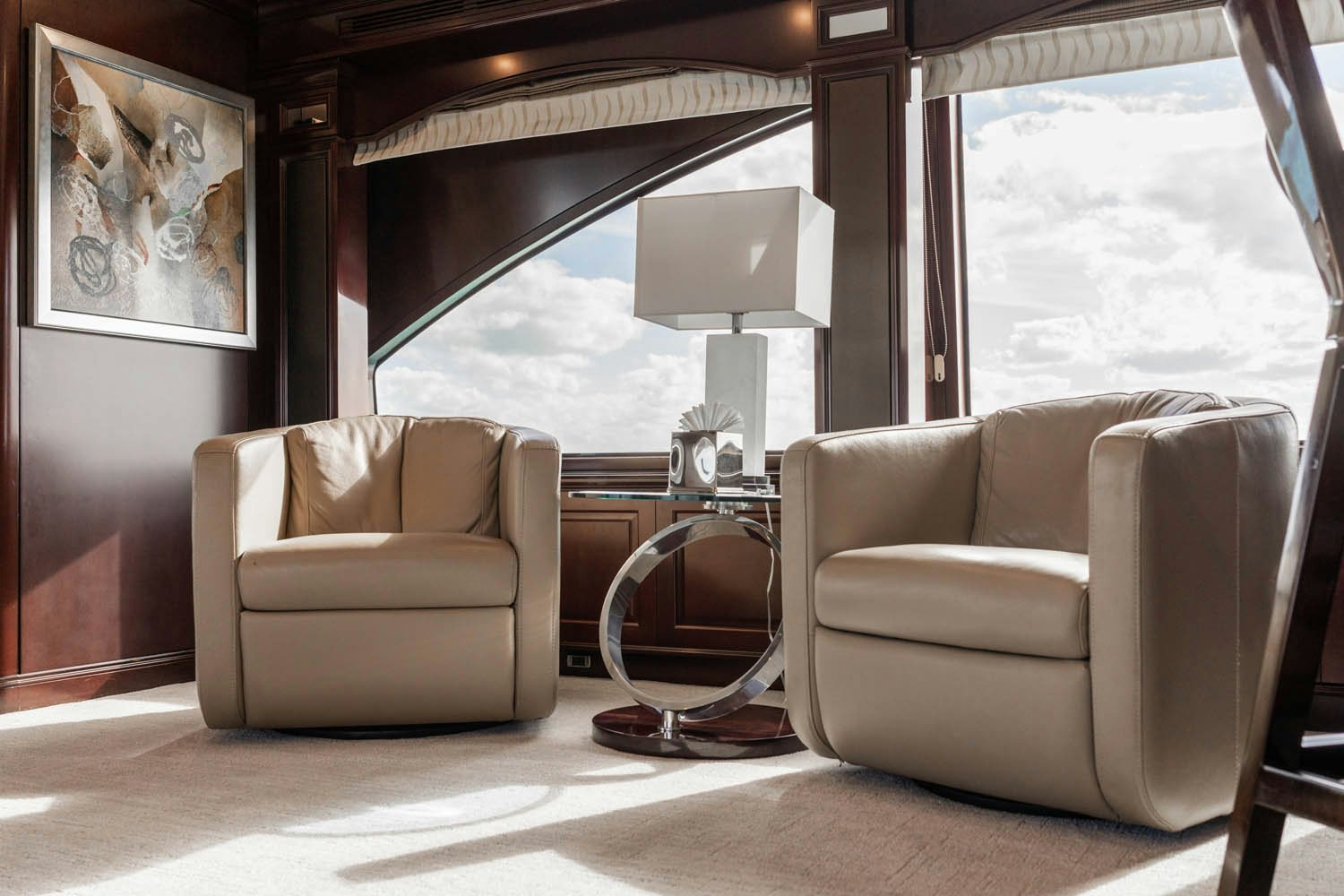 a living room with a large window aboard NICOLE EVELYN Yacht for Charter