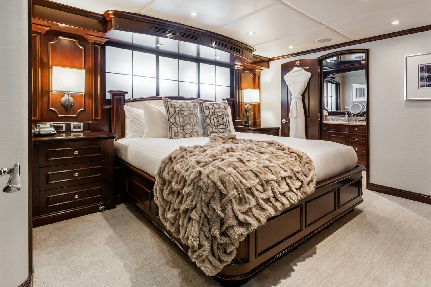 a bedroom with a large bed aboard NICOLE EVELYN Yacht for Charter