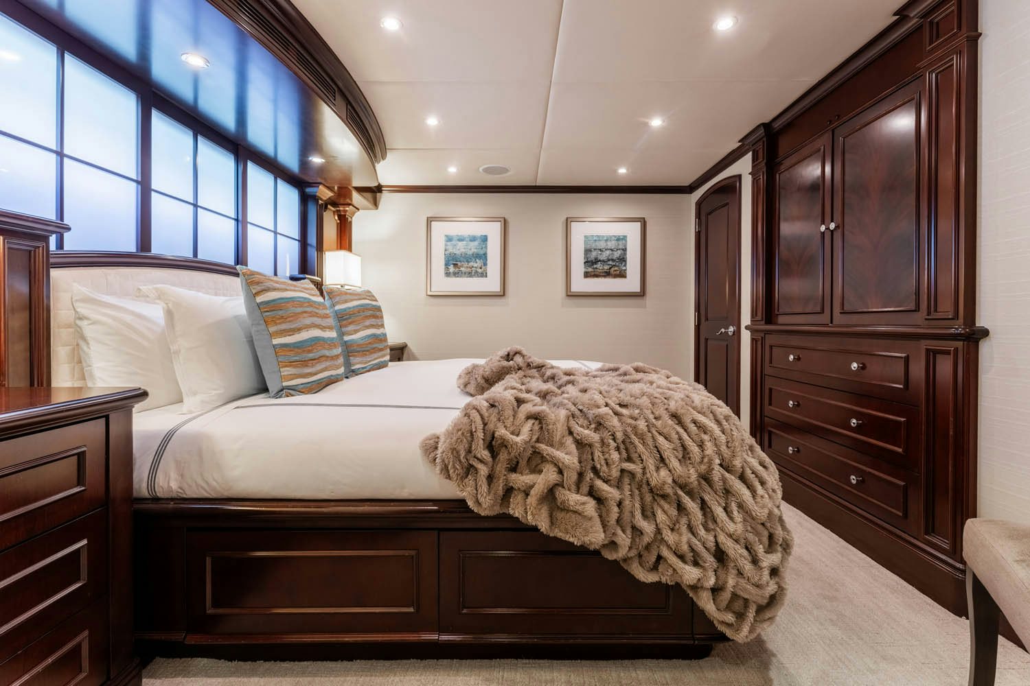 a bedroom with a large bed aboard NICOLE EVELYN Yacht for Charter