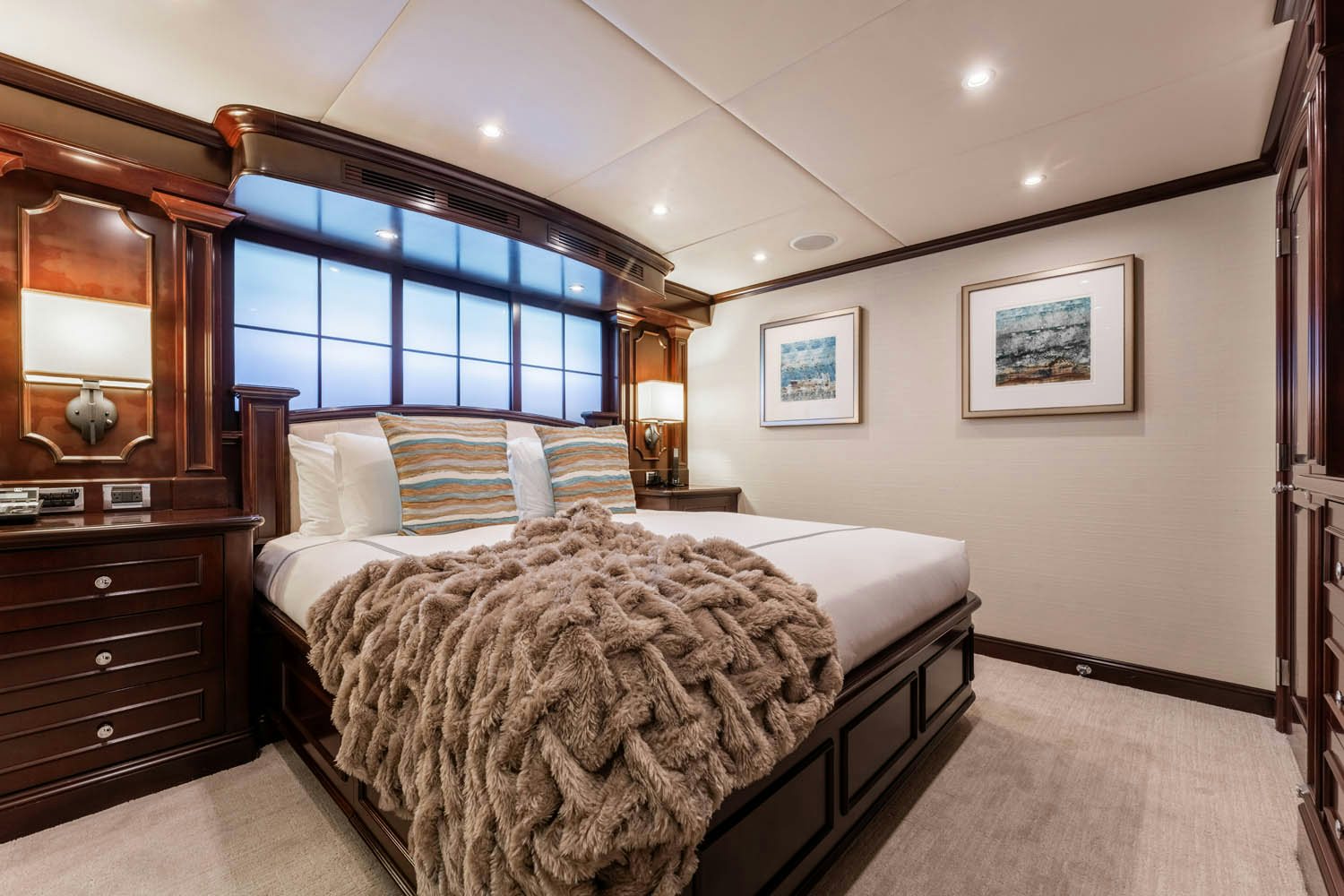 a bedroom with two beds aboard NICOLE EVELYN Yacht for Charter