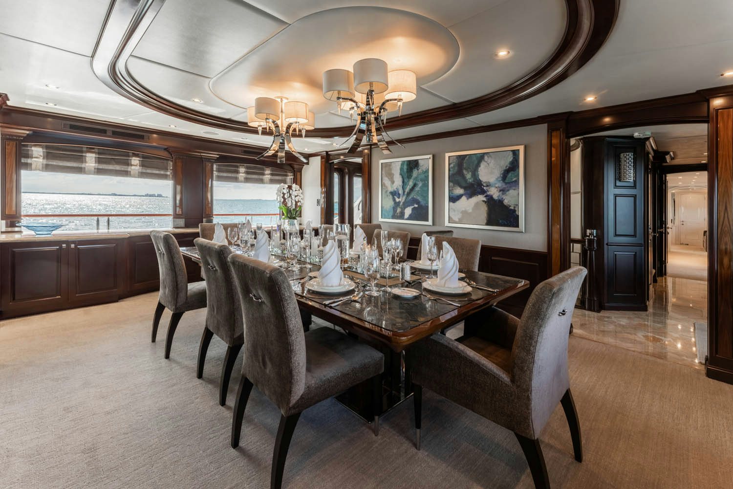 a dining room with a table and chairs aboard NICOLE EVELYN Yacht for Charter