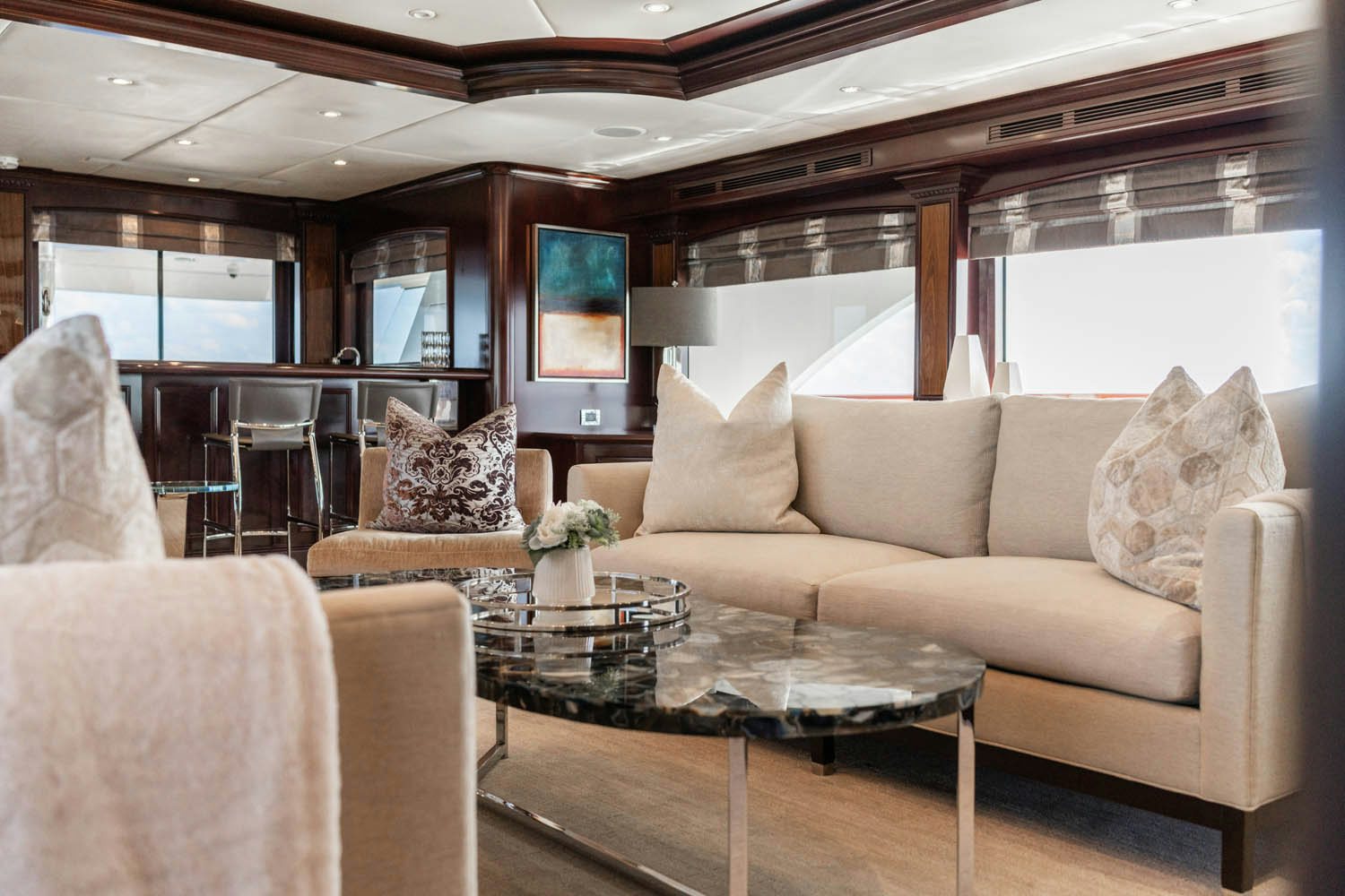 a living room with a couch and a coffee table aboard NICOLE EVELYN Yacht for Charter