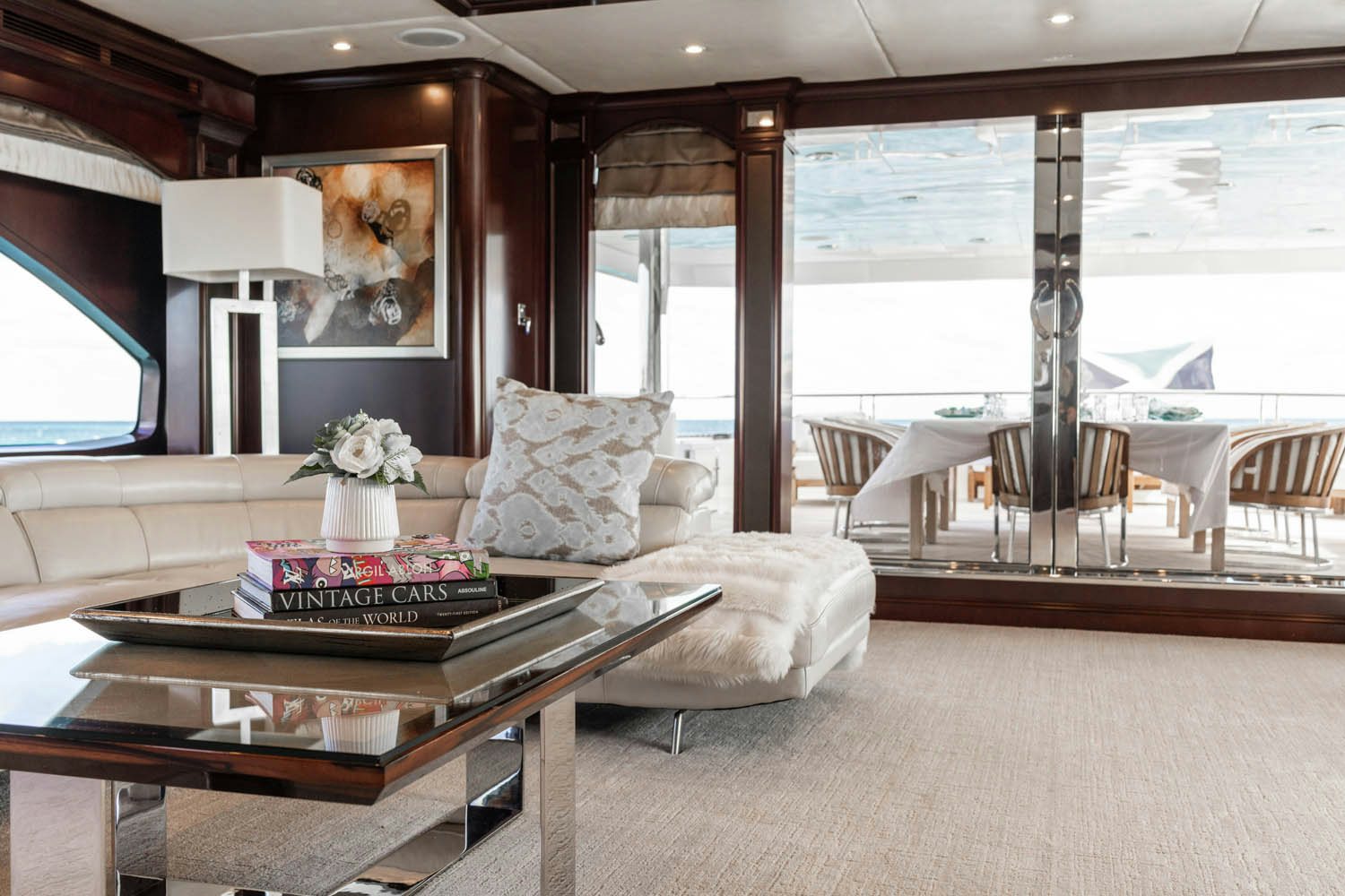 a living room with a large window aboard NICOLE EVELYN Yacht for Charter