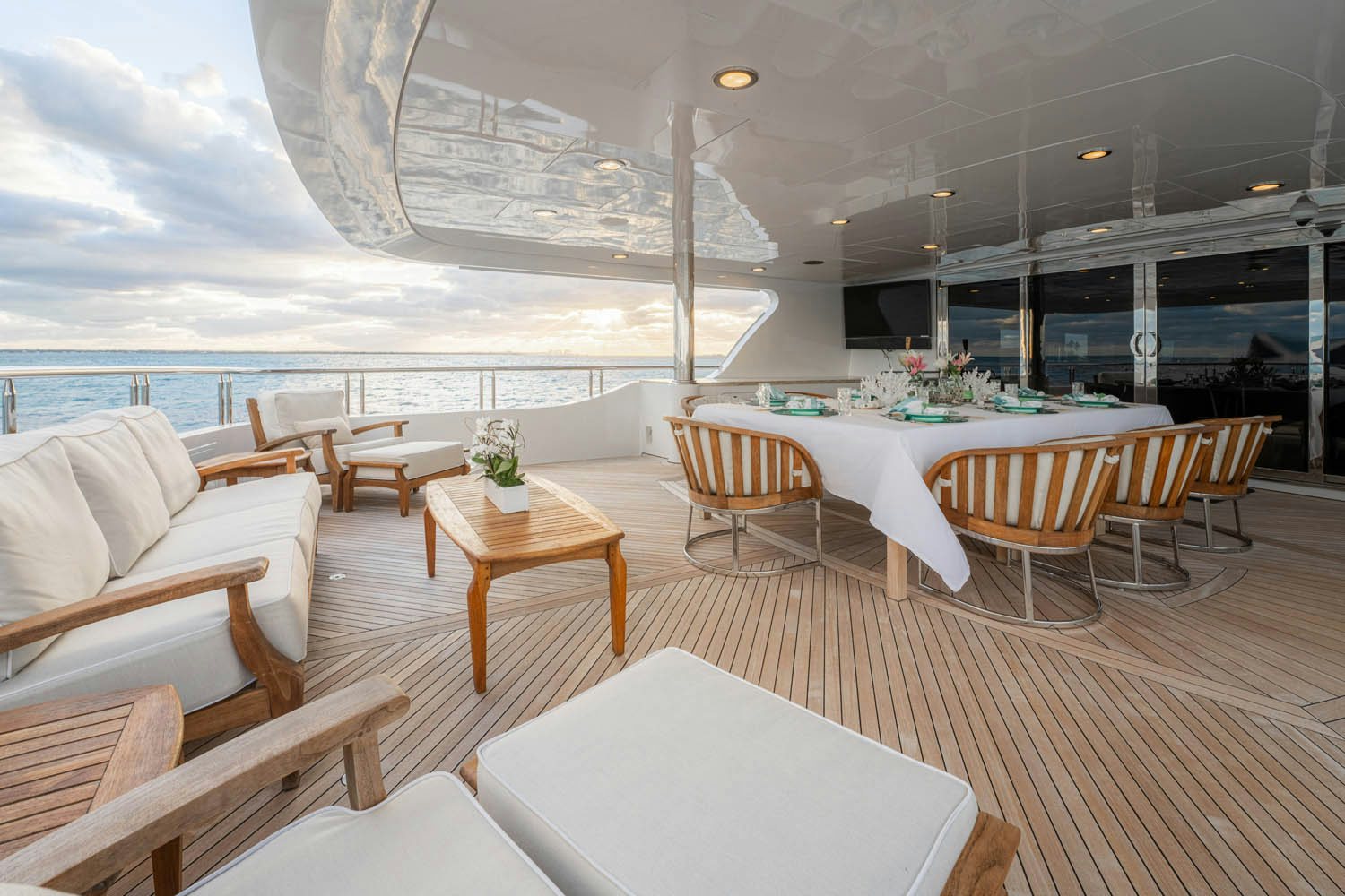 a room with tables and chairs aboard NICOLE EVELYN Yacht for Charter