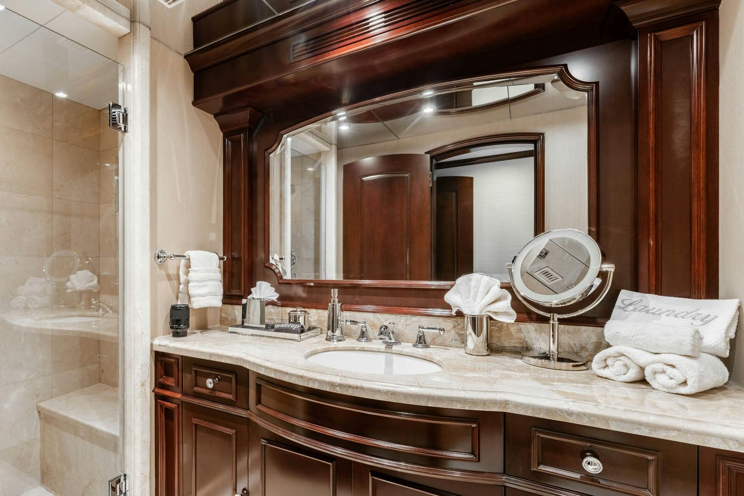 a bathroom with a large mirror aboard NICOLE EVELYN Yacht for Charter