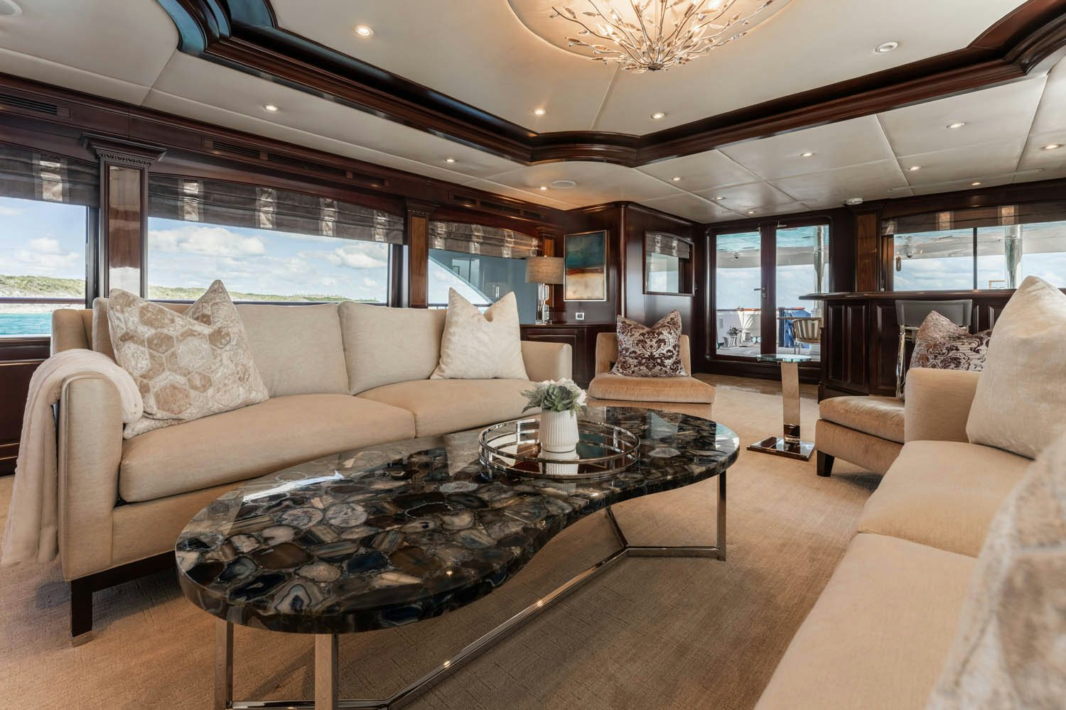a living room with a large window aboard NICOLE EVELYN Yacht for Charter