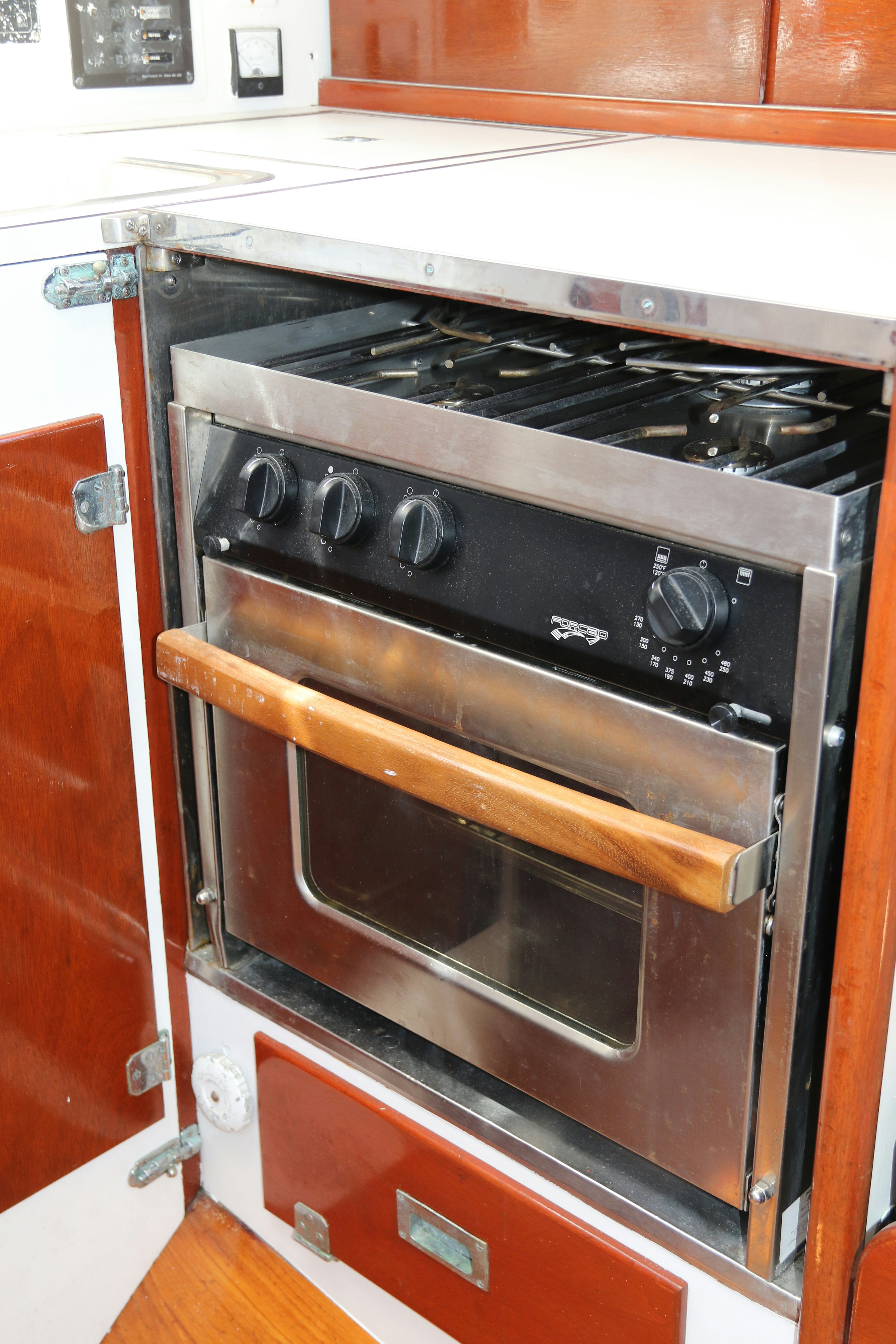a stove with a wood door aboard ESOTERIC Yacht for Sale