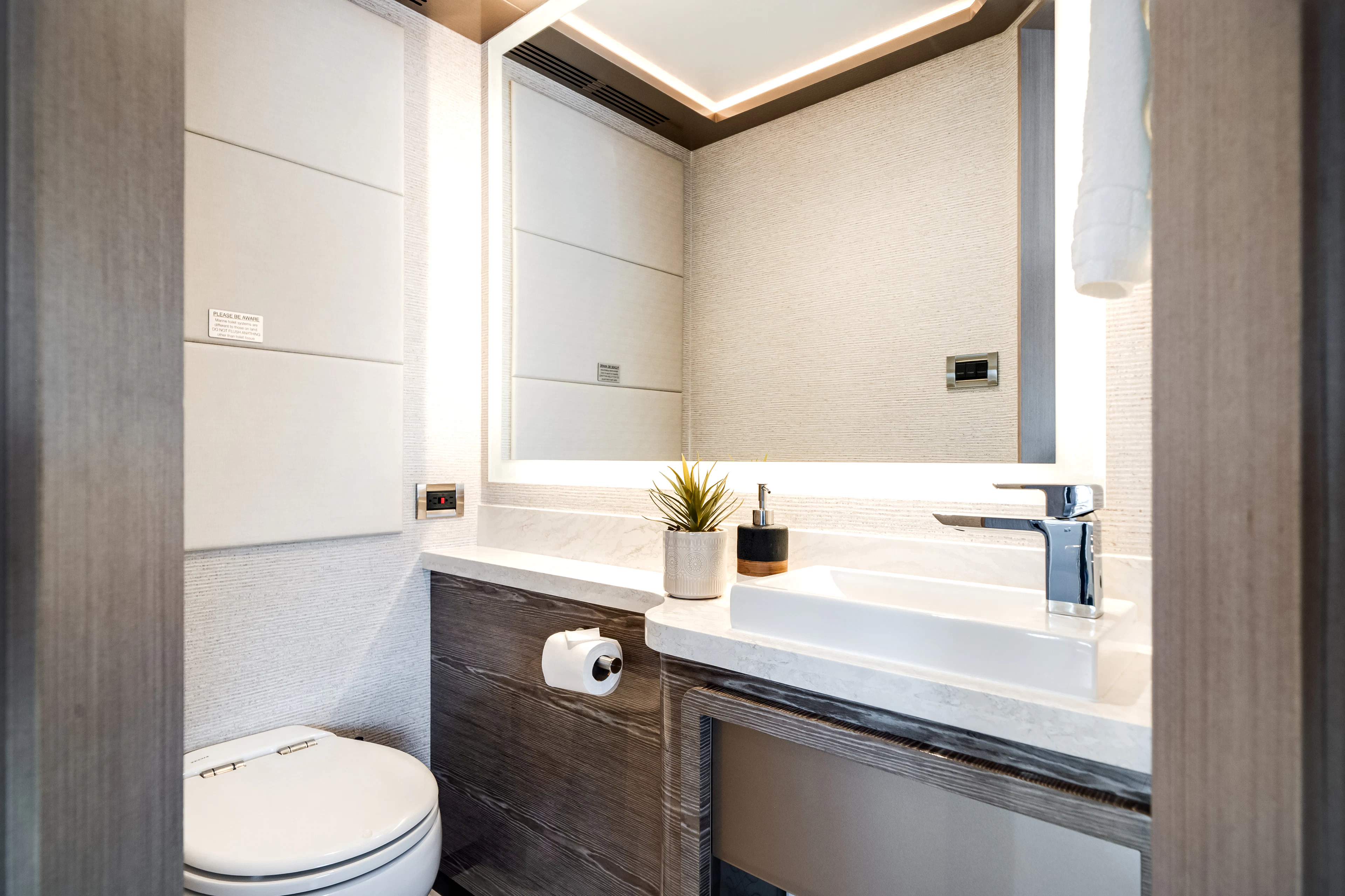a bathroom with a sink and toilet aboard JUST A VACATION Yacht for Sale