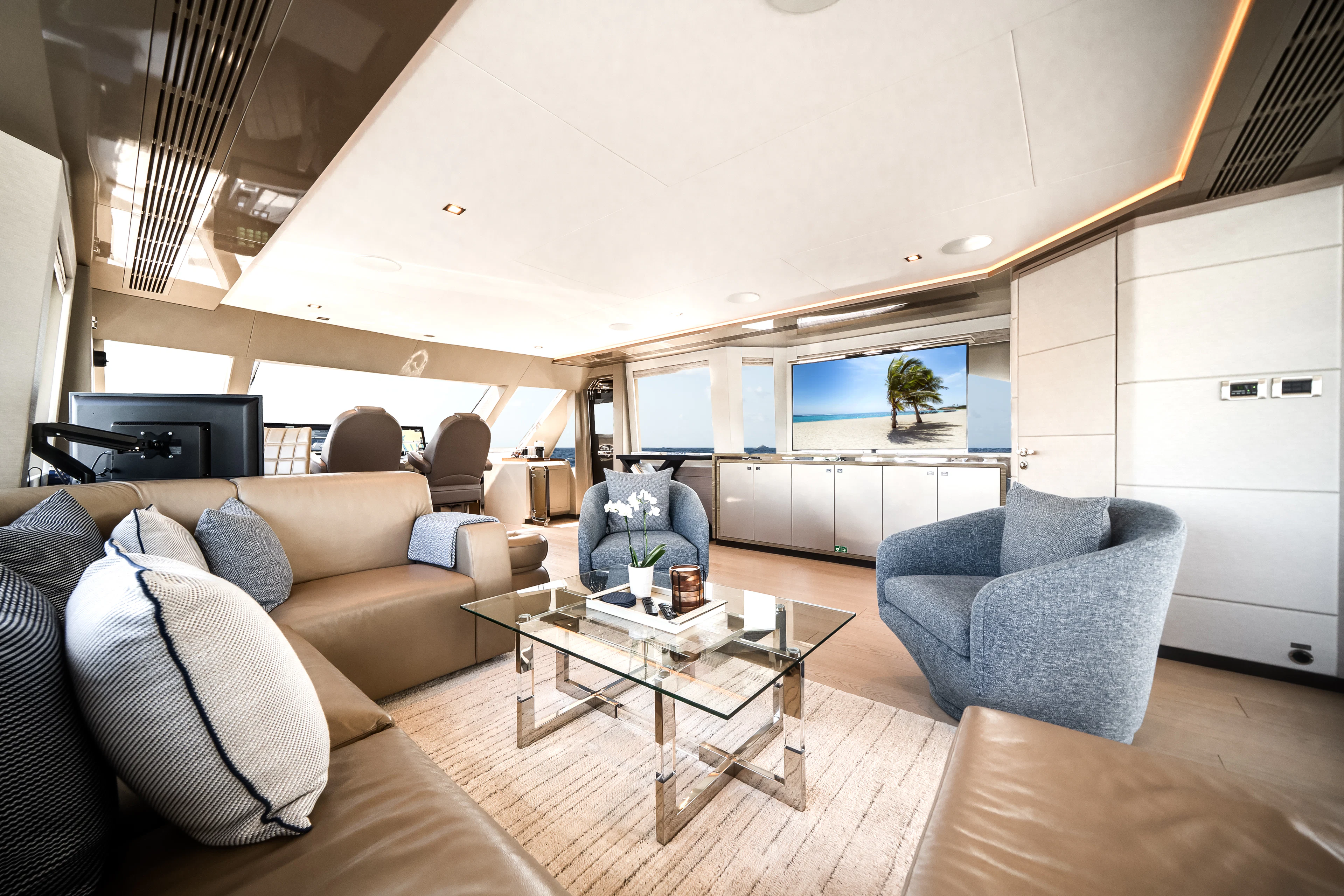 a living room with a large window aboard JUST A VACATION Yacht for Sale