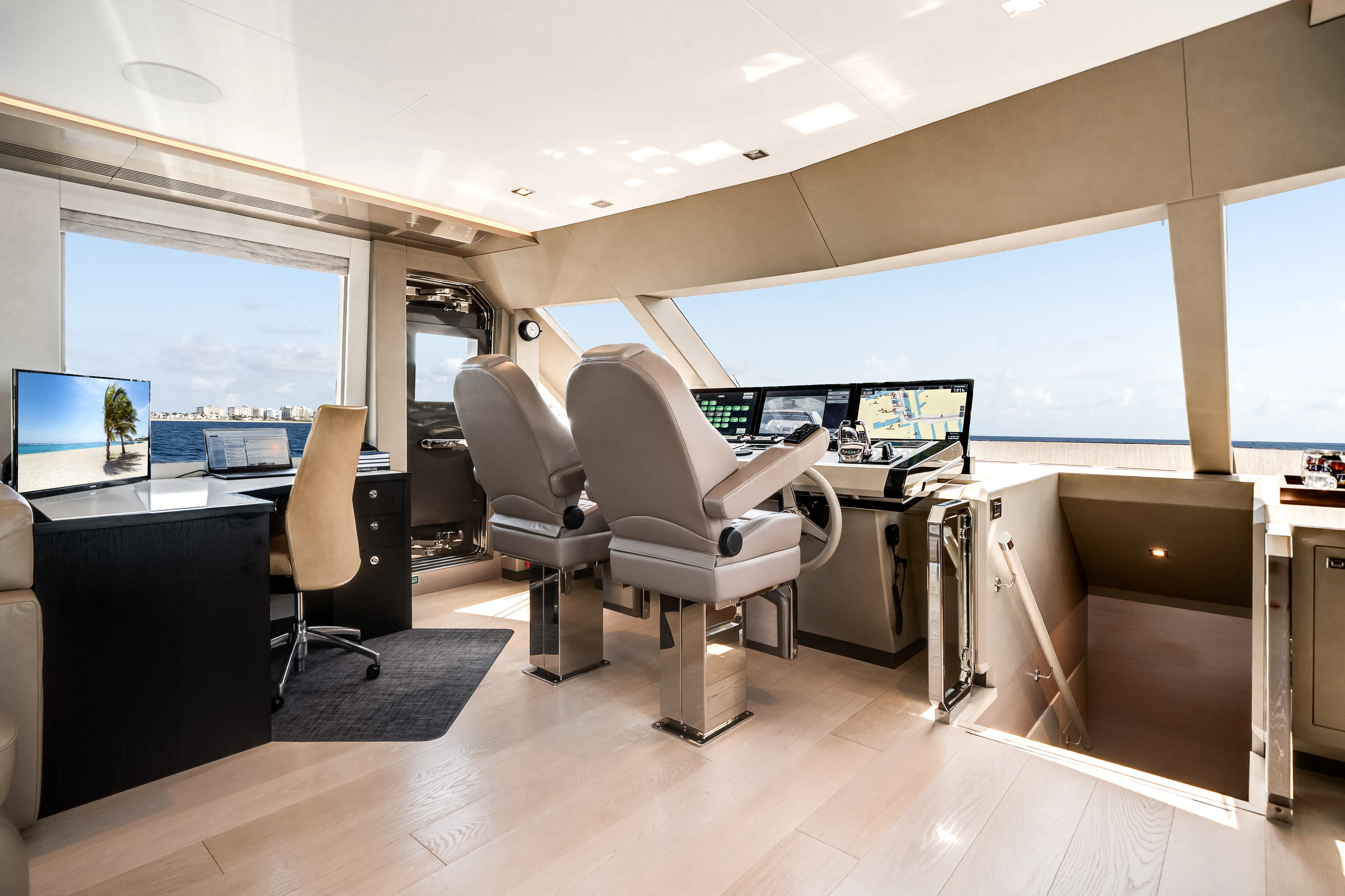 an office with a large window aboard JUST A VACATION Yacht for Sale