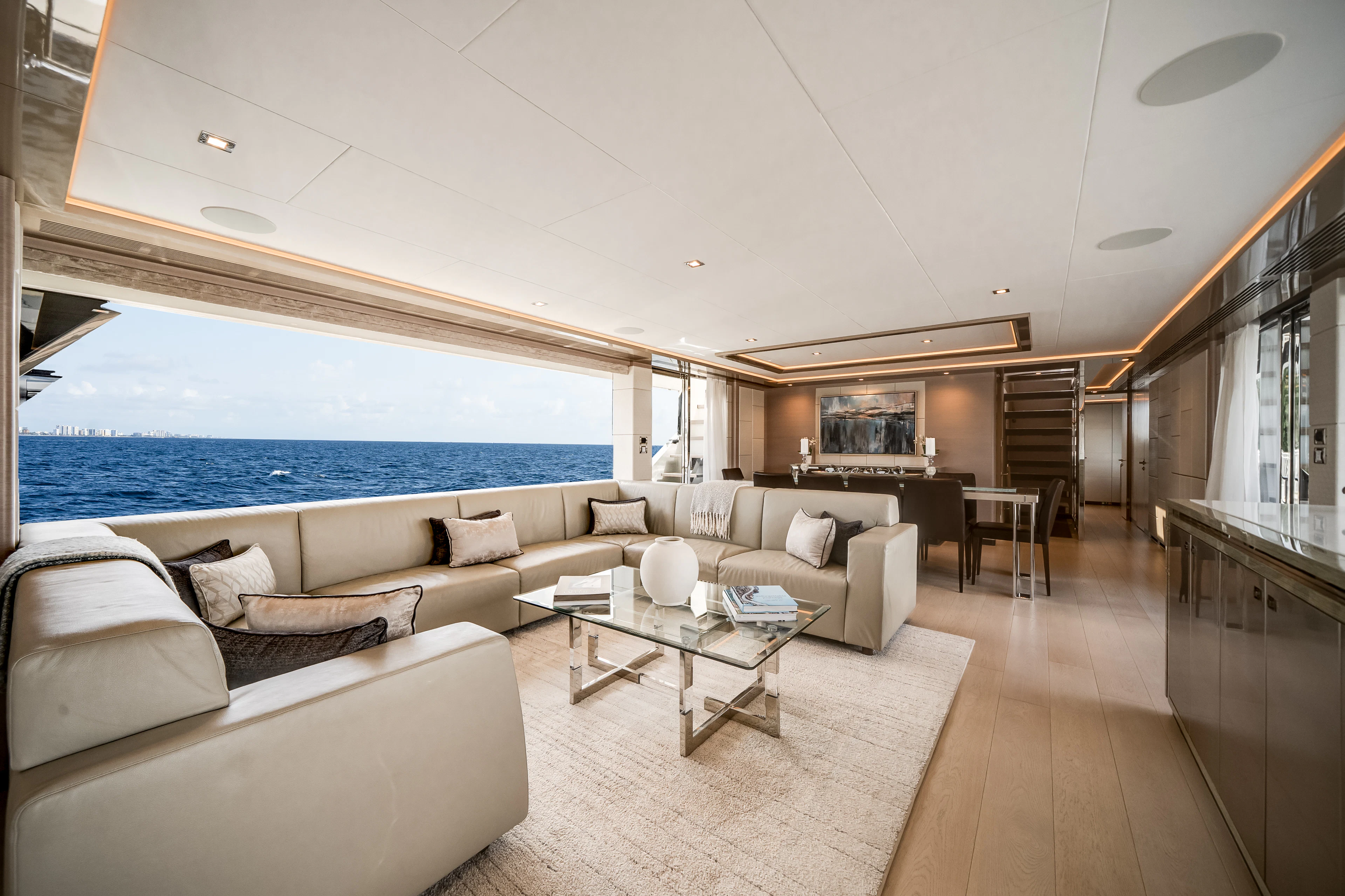 a living room with a large pool aboard JUST A VACATION Yacht for Sale