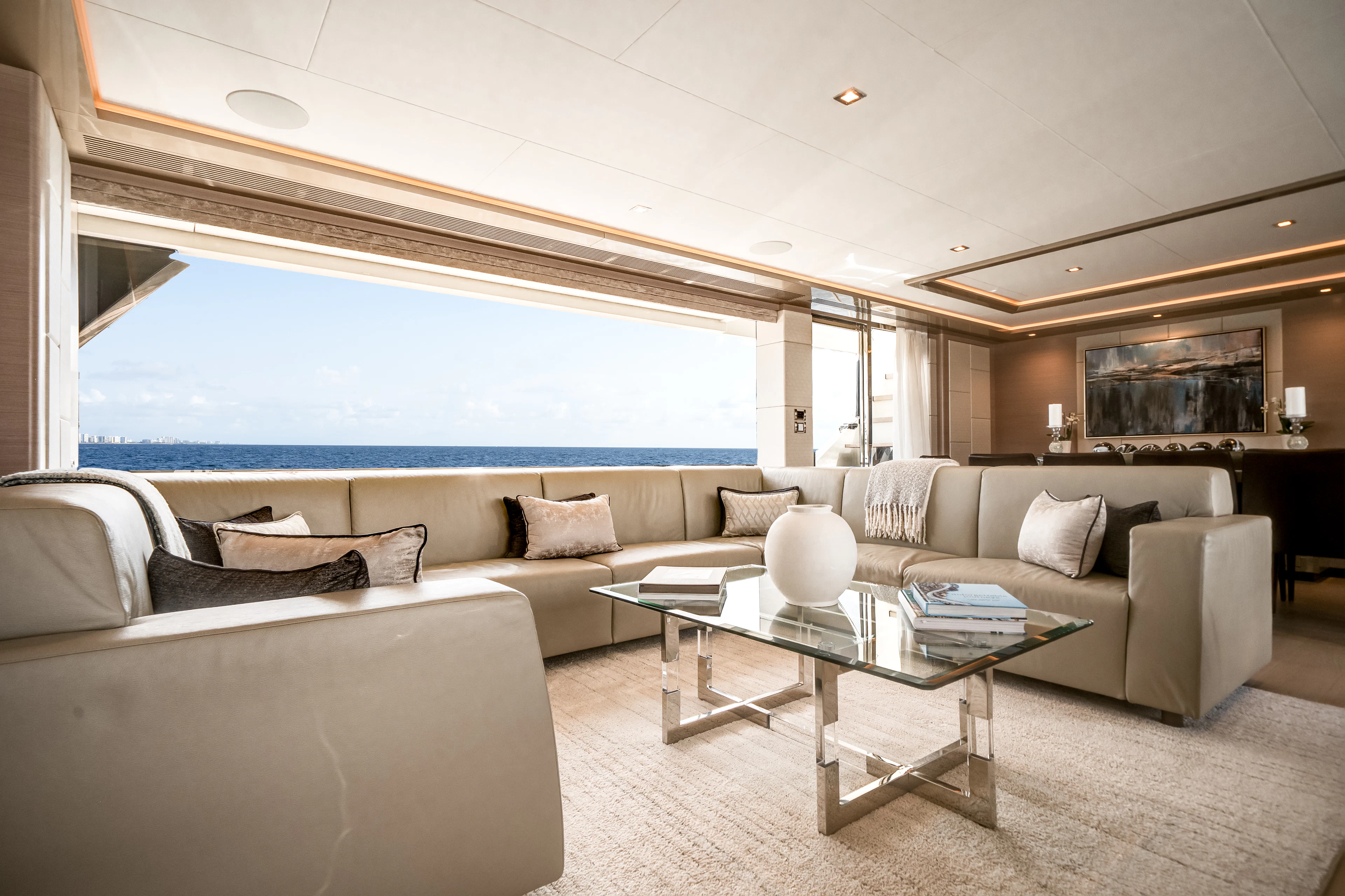 a living room with a large window aboard JUST A VACATION Yacht for Sale