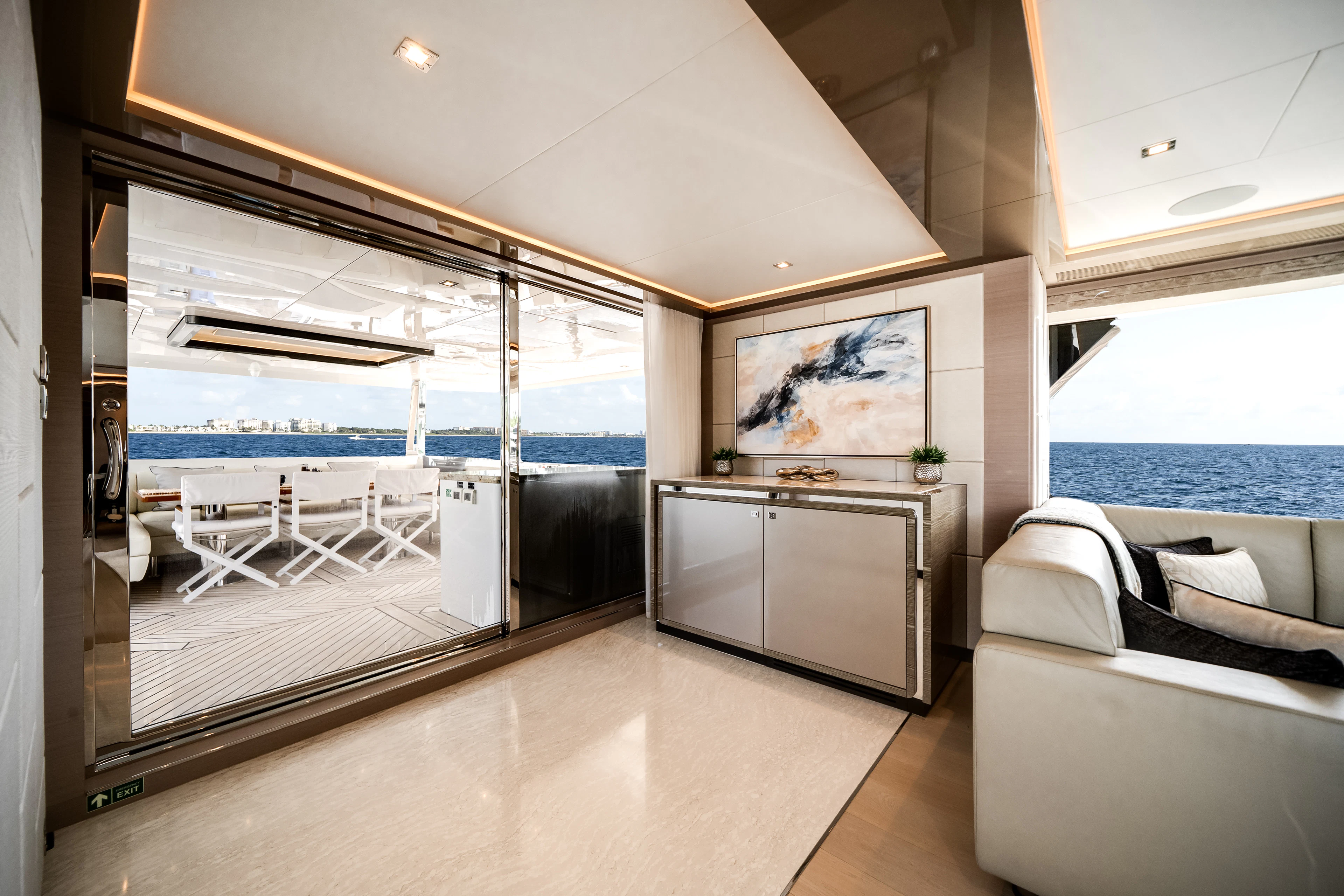 a living room with a large open window aboard JUST A VACATION Yacht for Sale