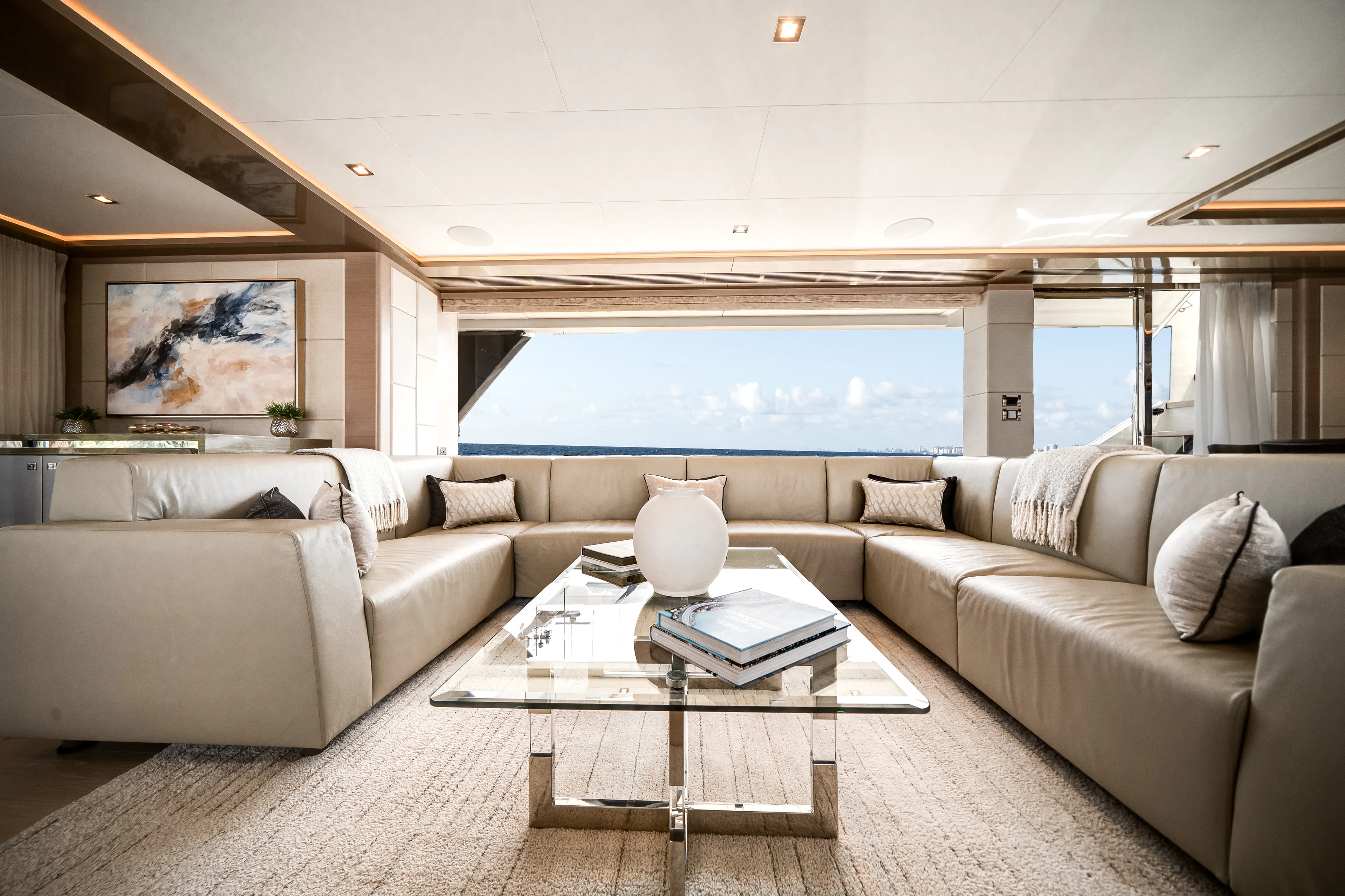 a living room with a large window aboard JUST A VACATION Yacht for Sale