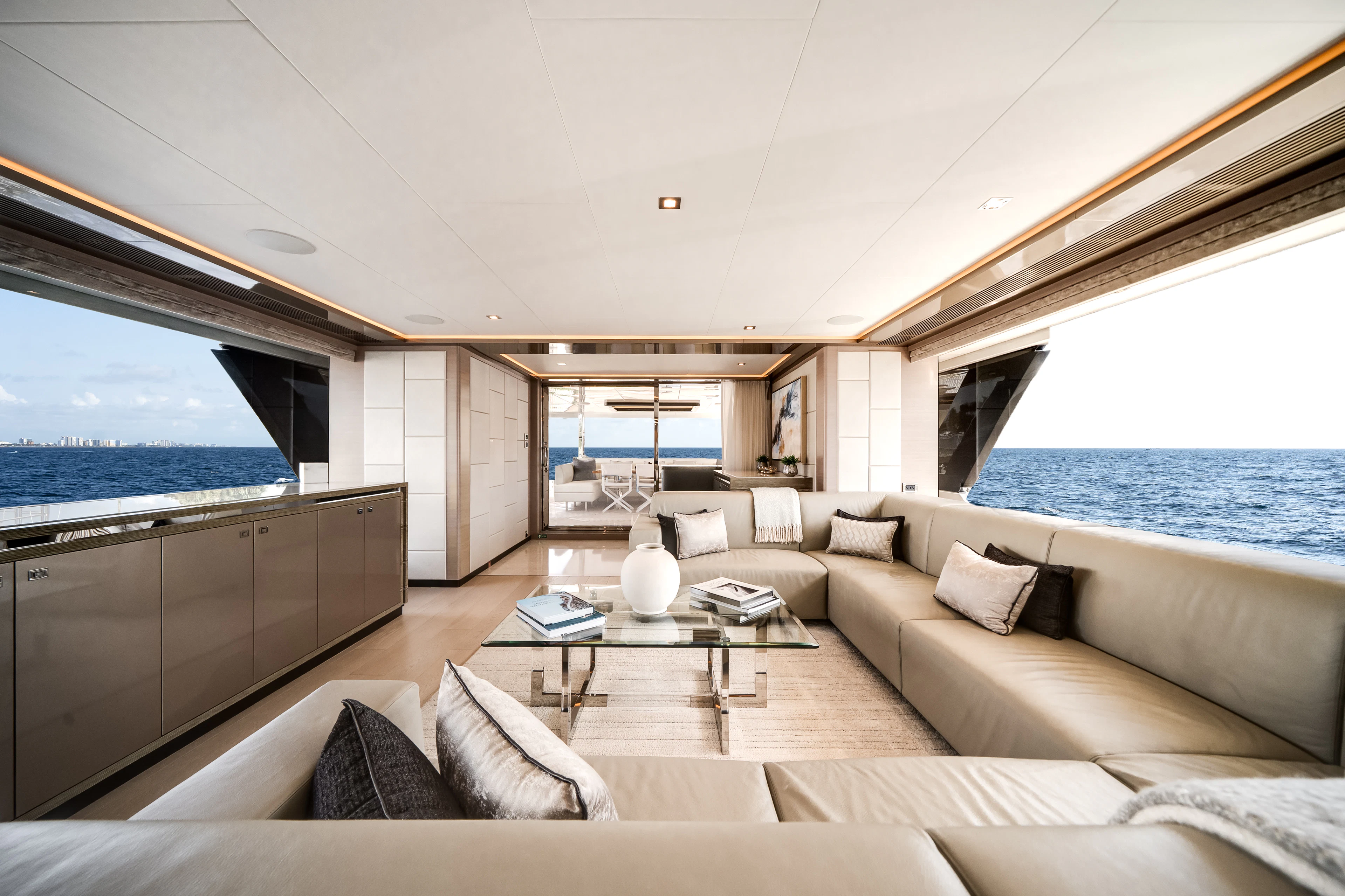 a living room with a large window aboard JUST A VACATION Yacht for Sale
