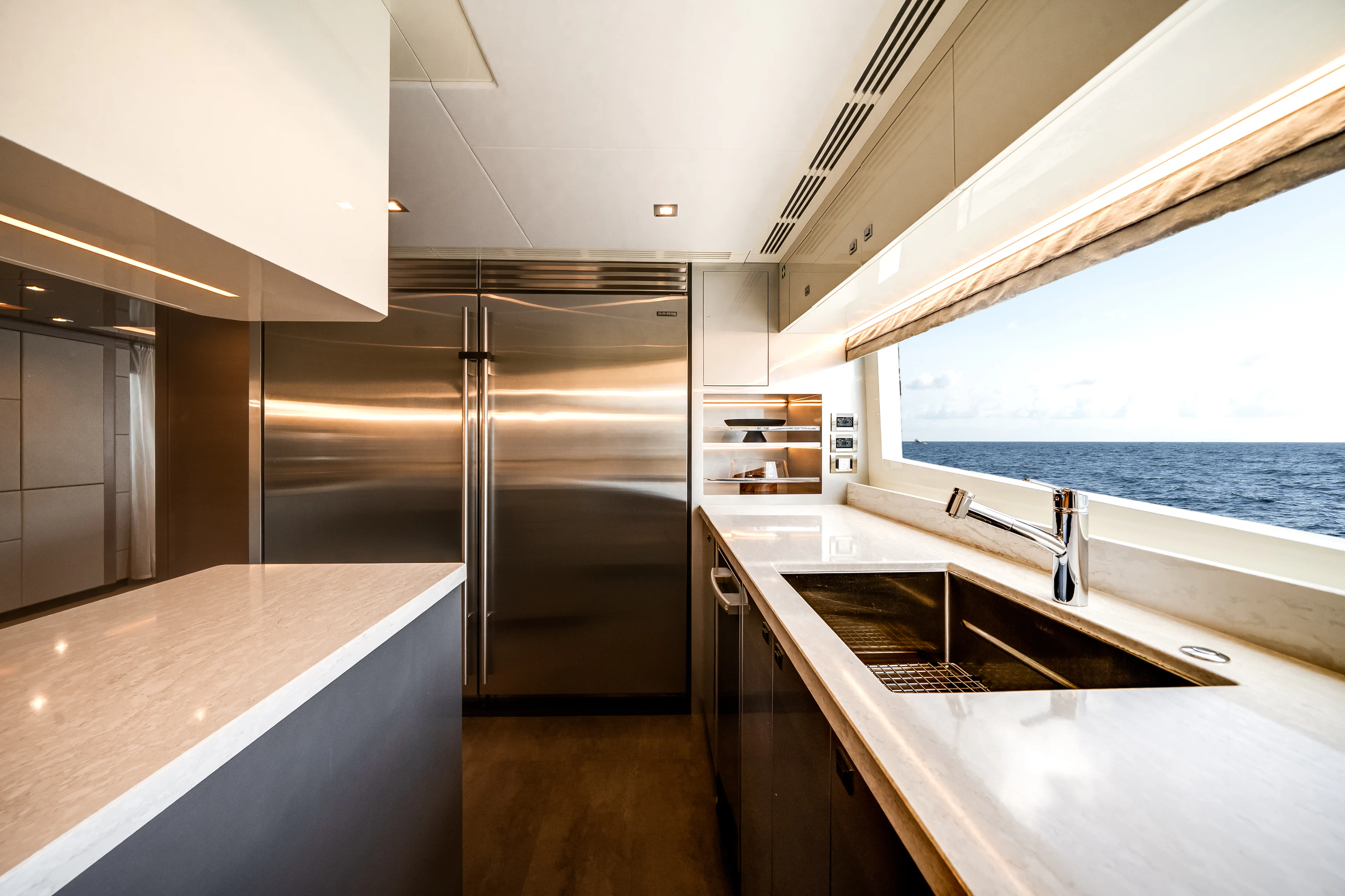 a kitchen with a large refrigerator aboard JUST A VACATION Yacht for Sale