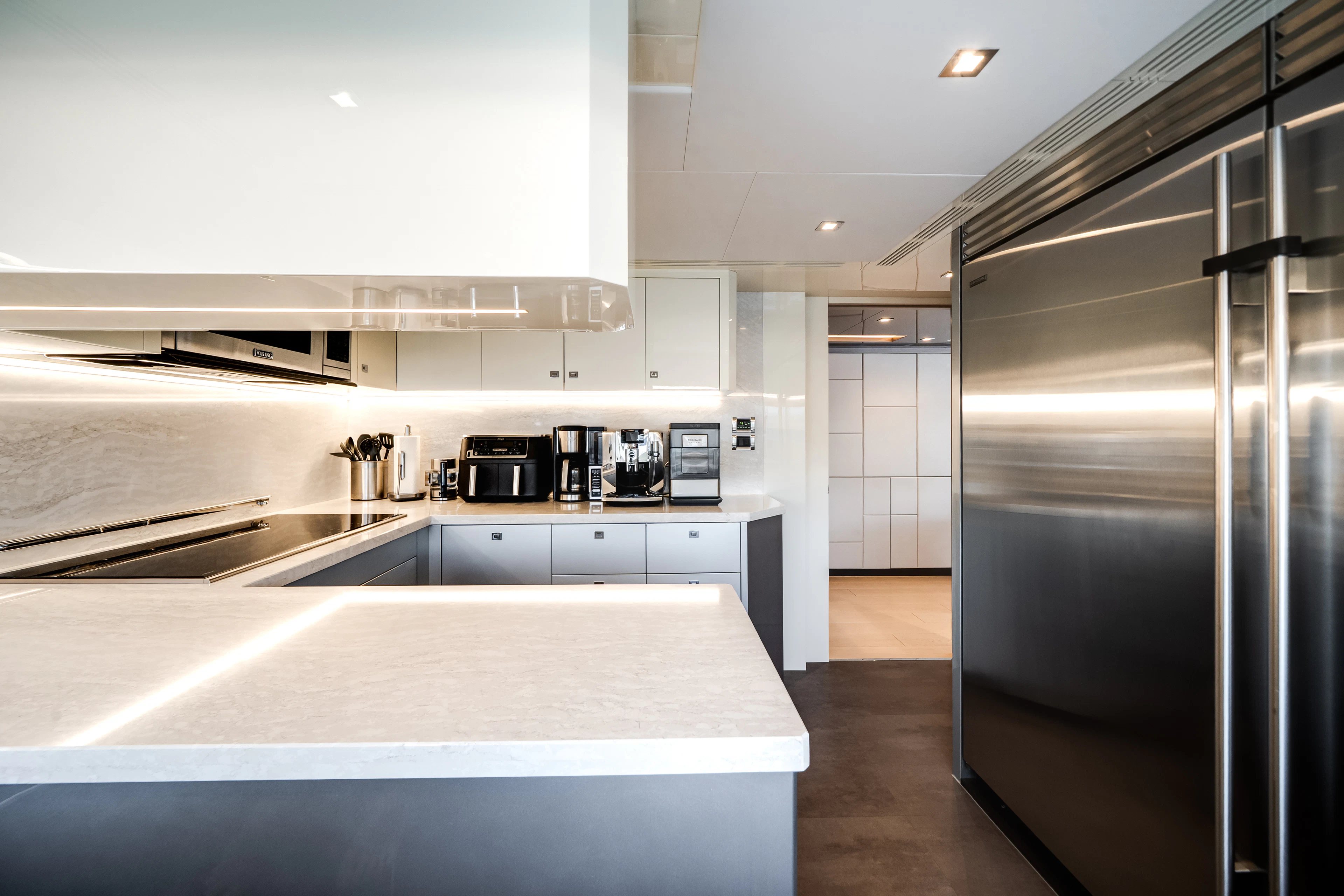 a kitchen with stainless steel appliances aboard JUST A VACATION Yacht for Sale