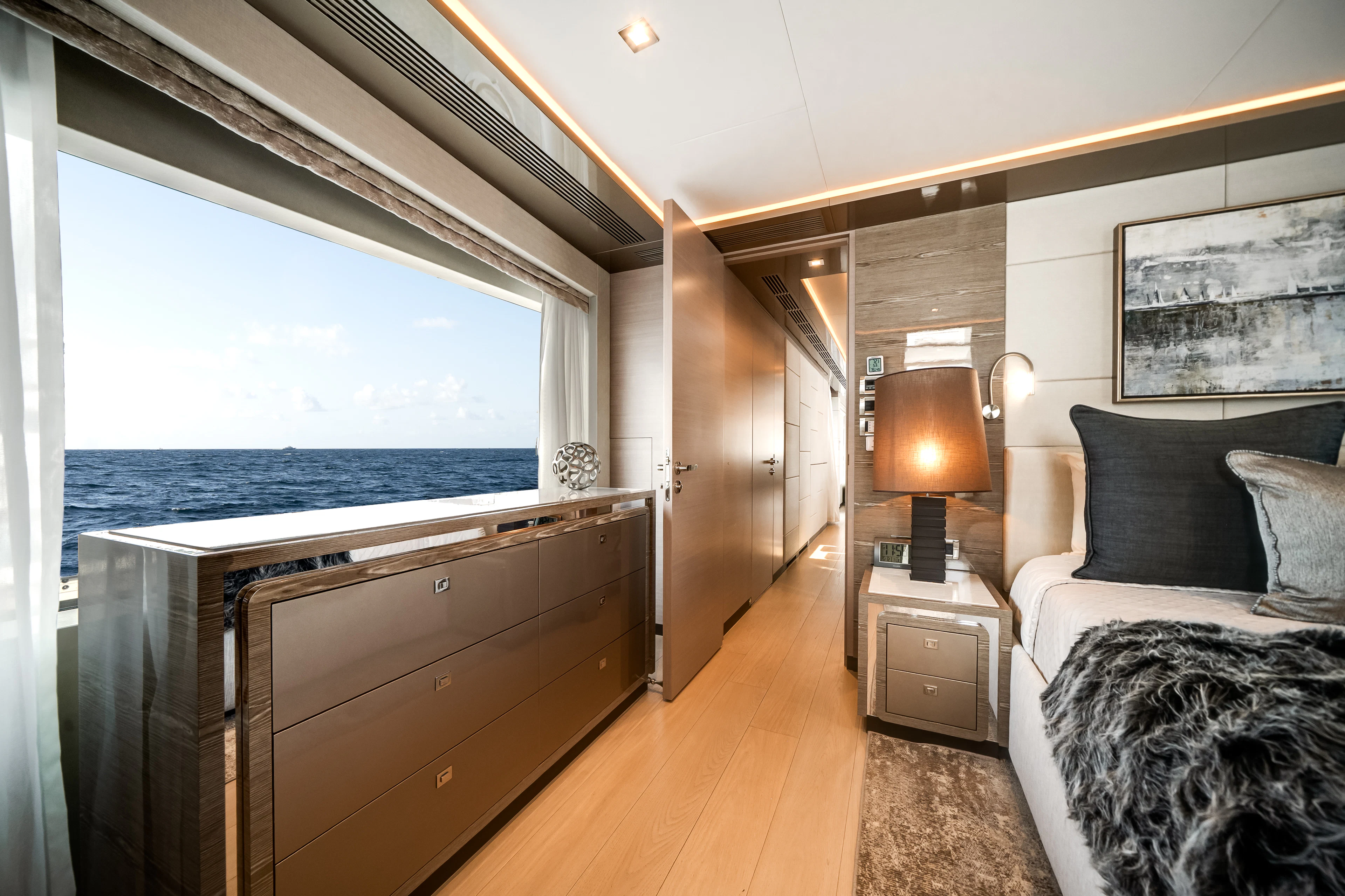 a bedroom with a large window aboard JUST A VACATION Yacht for Sale